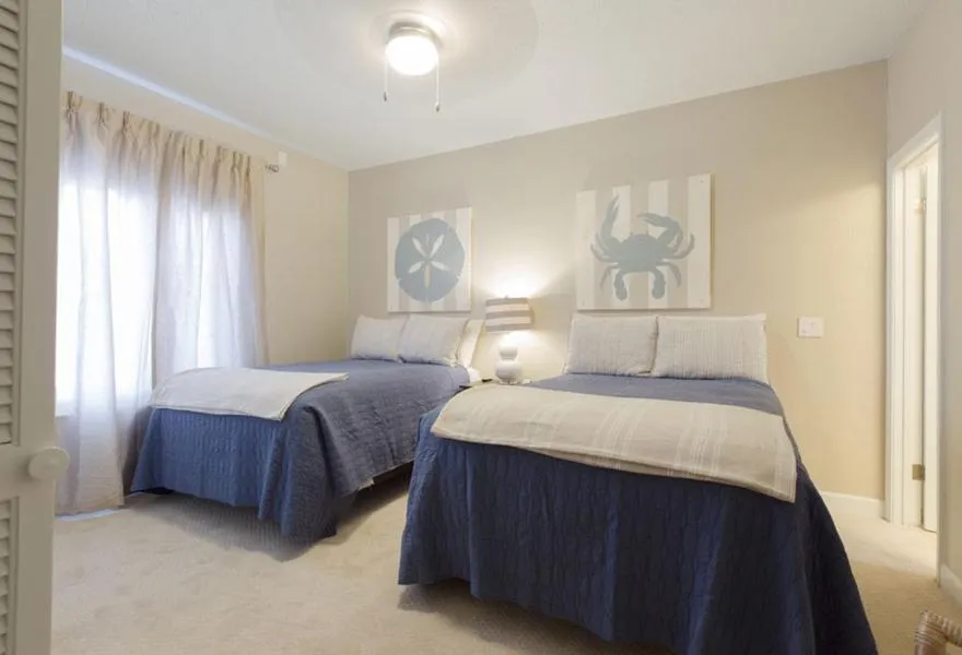 Bed in Sandpiper Beacon Beach Resort