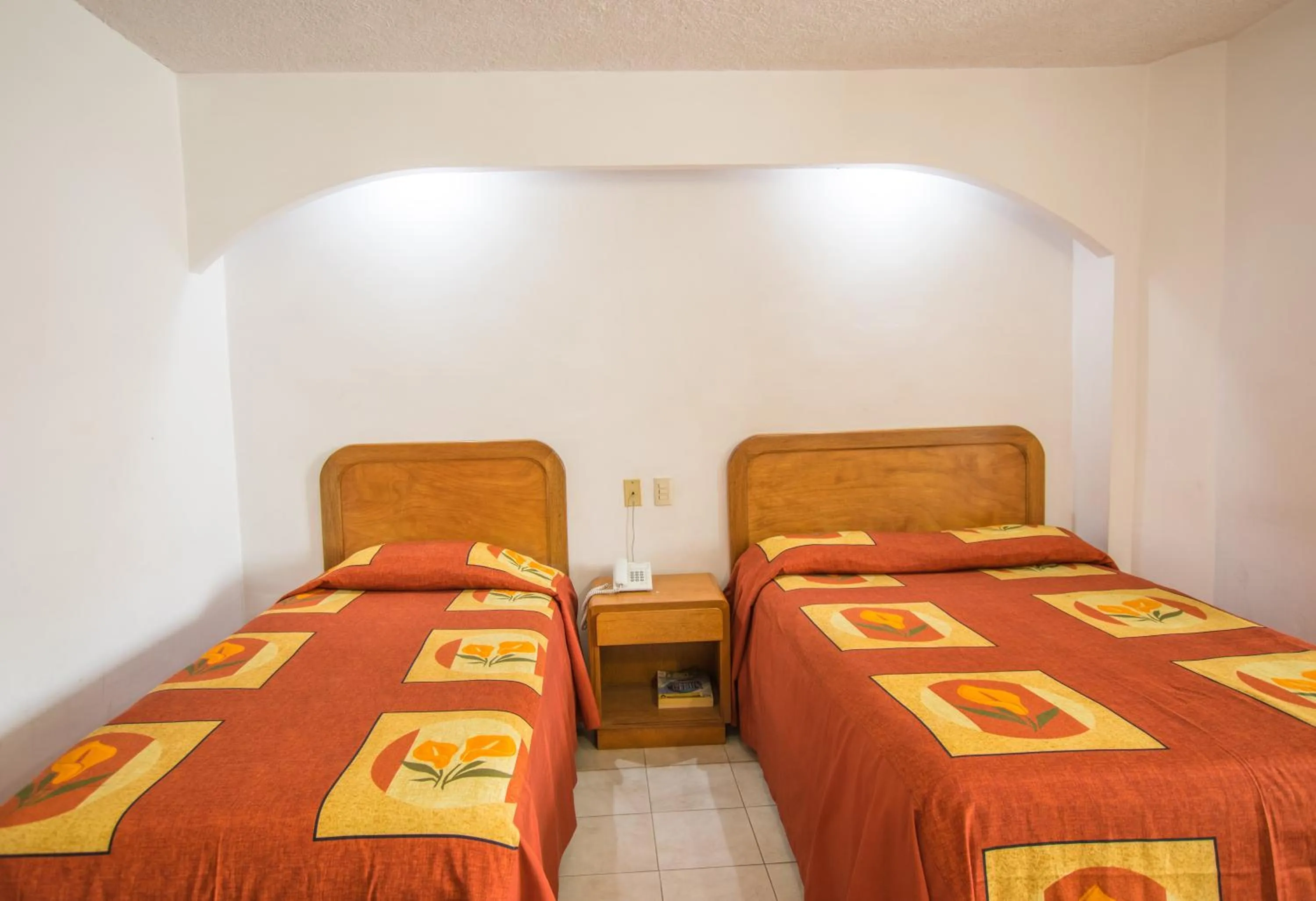 Bed in Suites Poliforum Inn