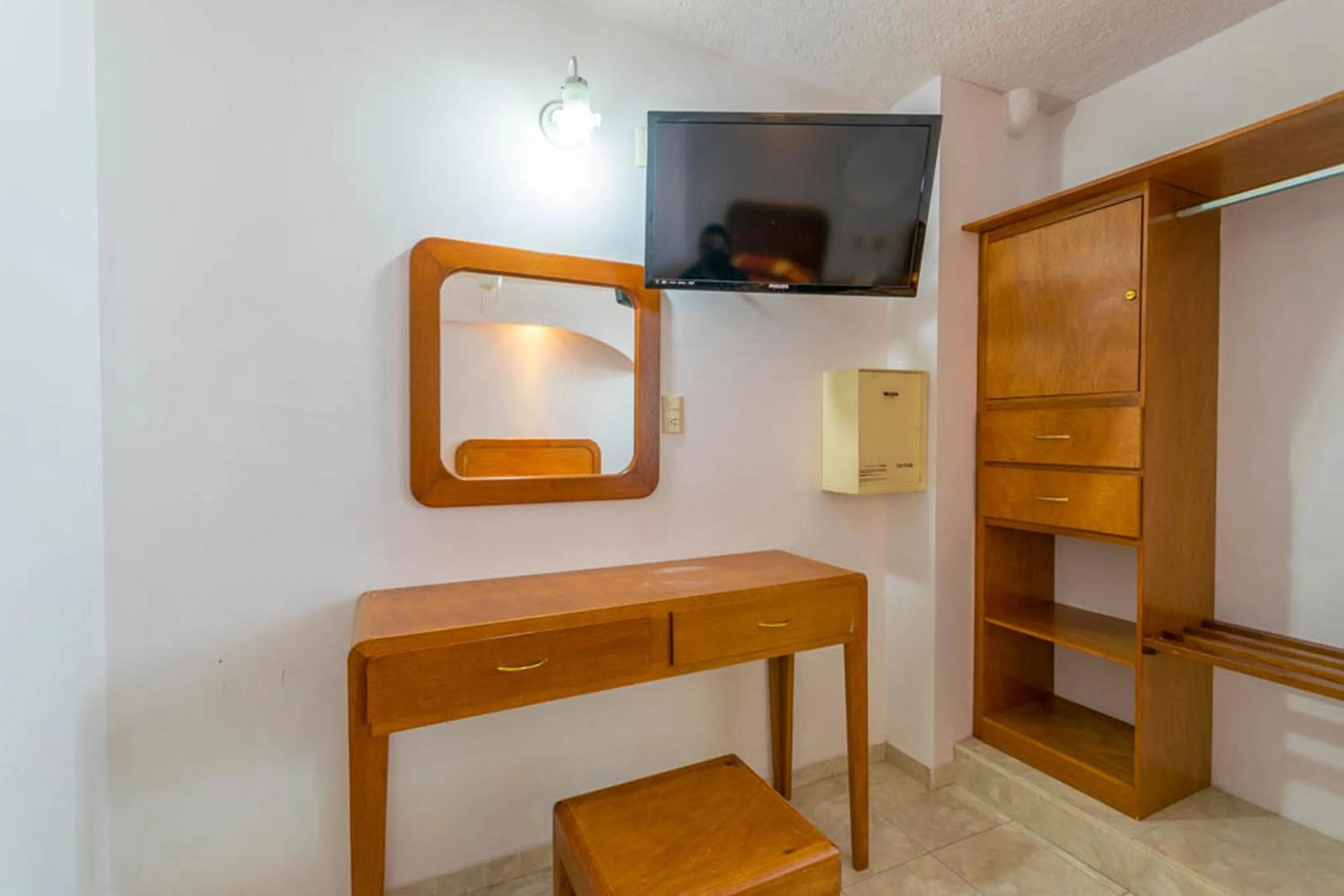 Bedroom in Suites Poliforum Inn