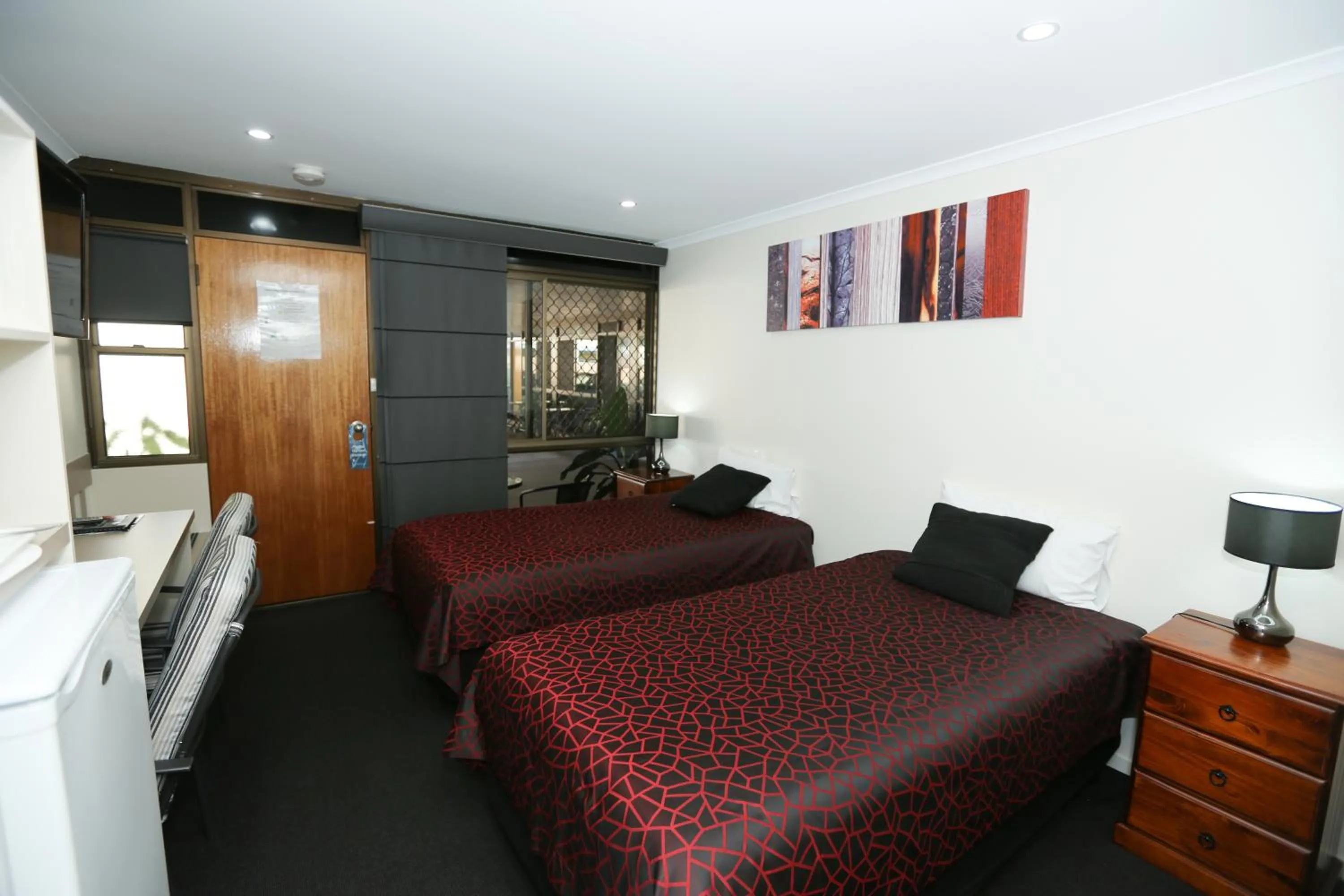 Bed in Amber Lodge Motel