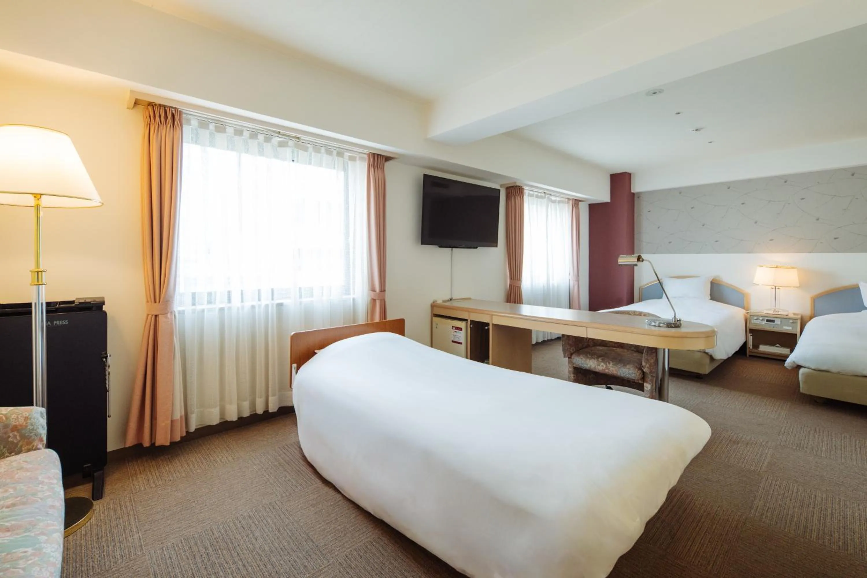 Photo of the whole room, Bed in Nest Hotel Matsuyama