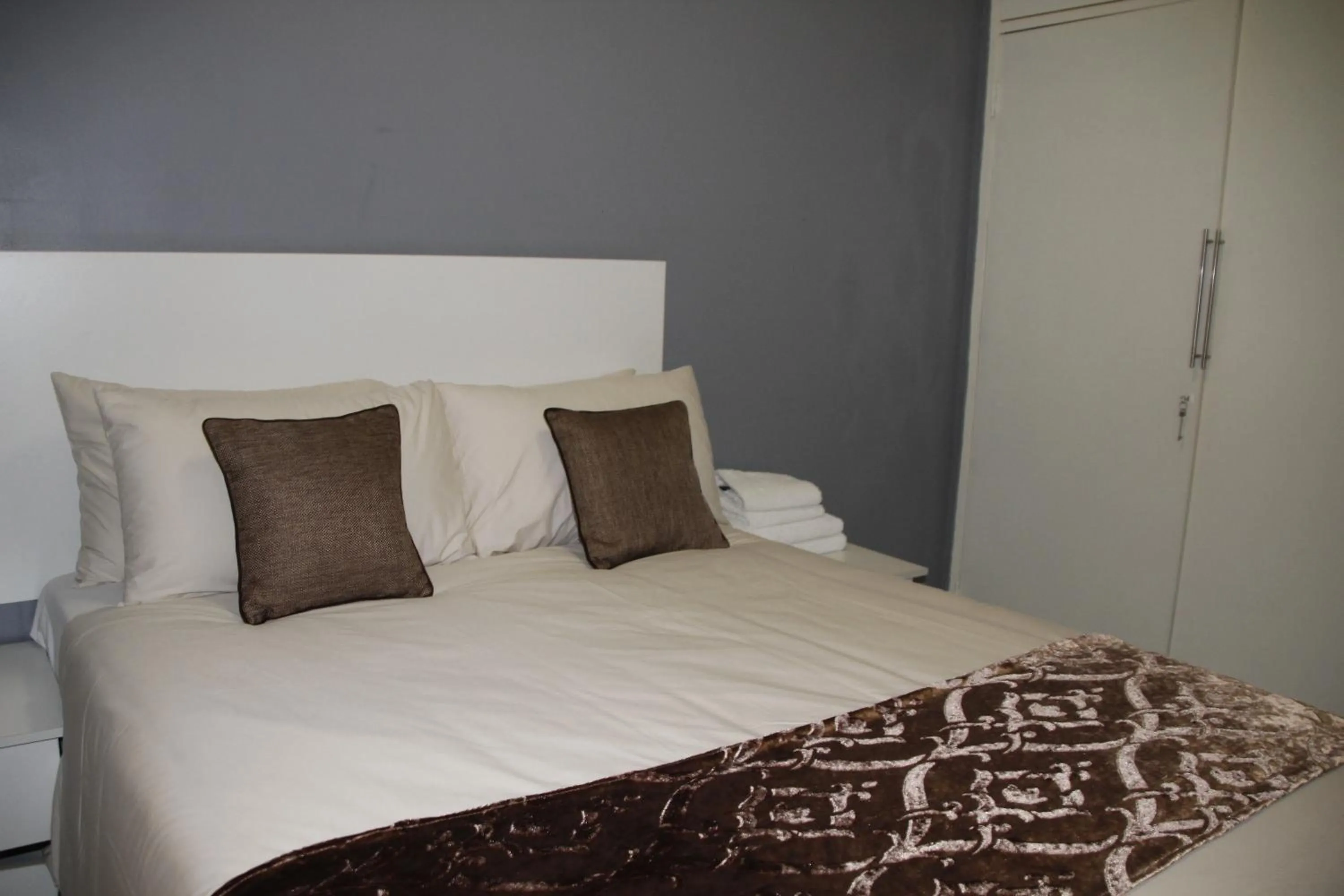 Bed in Asante Apartments