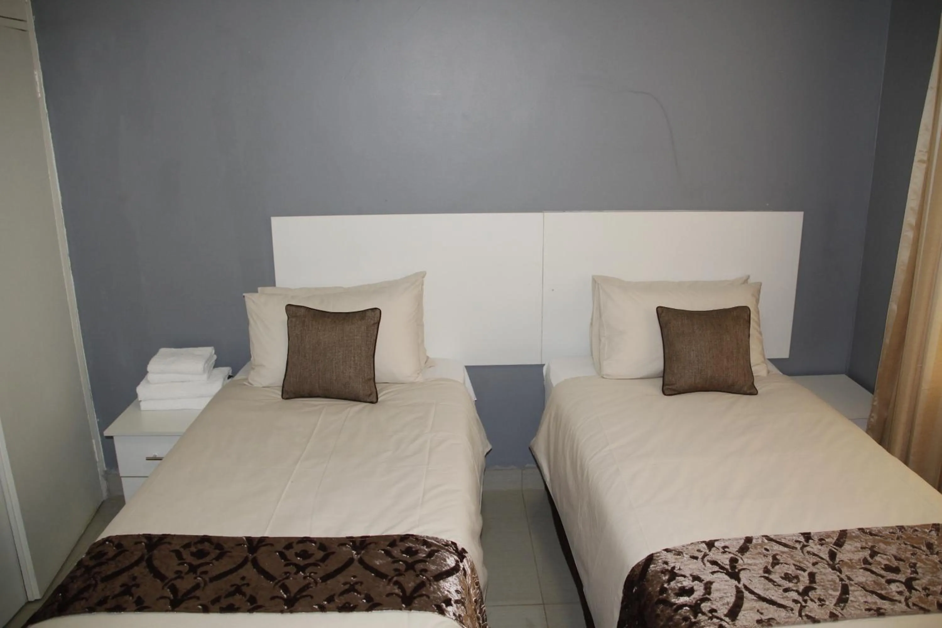 Bed in Asante Apartments