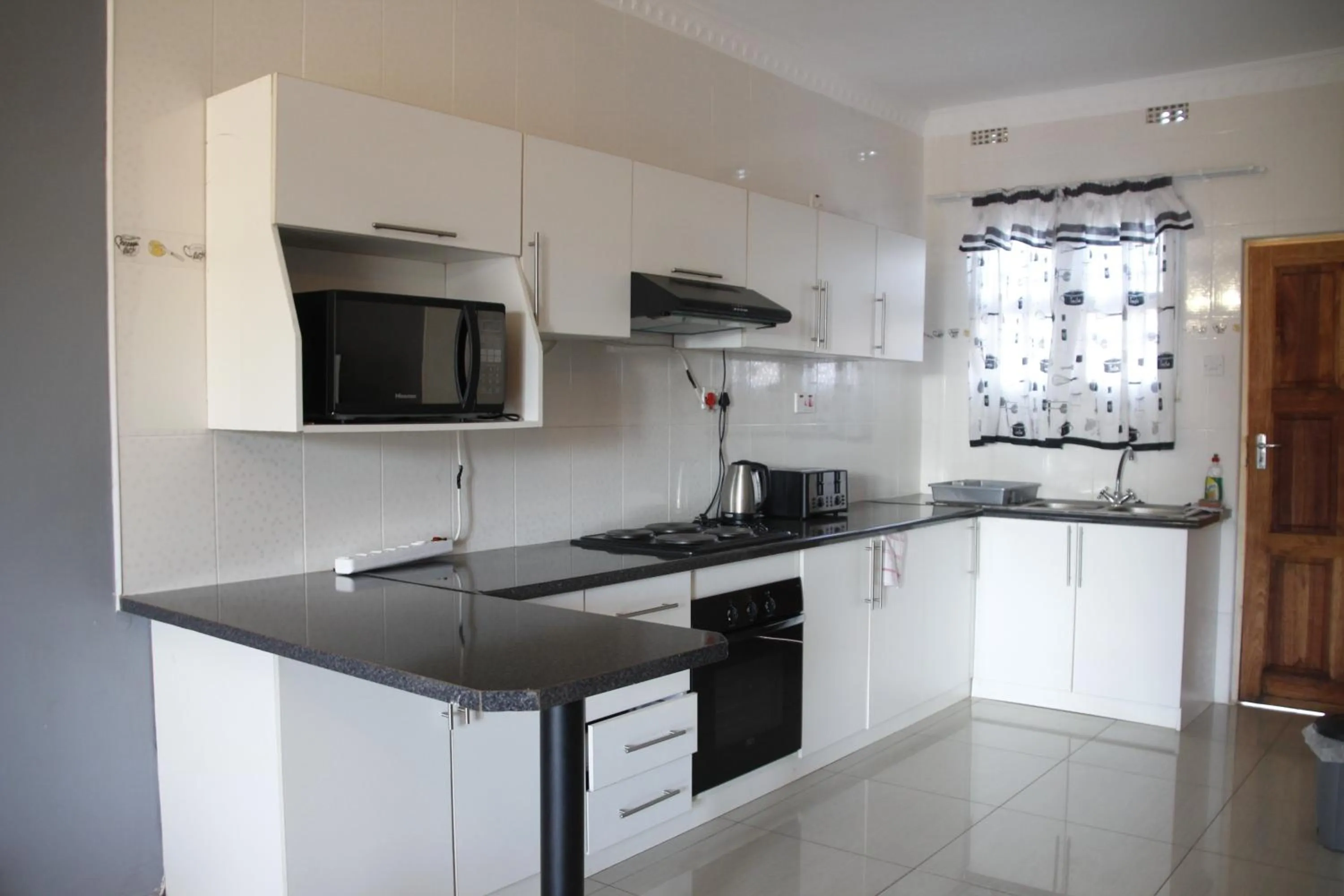 Kitchen or kitchenette in Asante Apartments