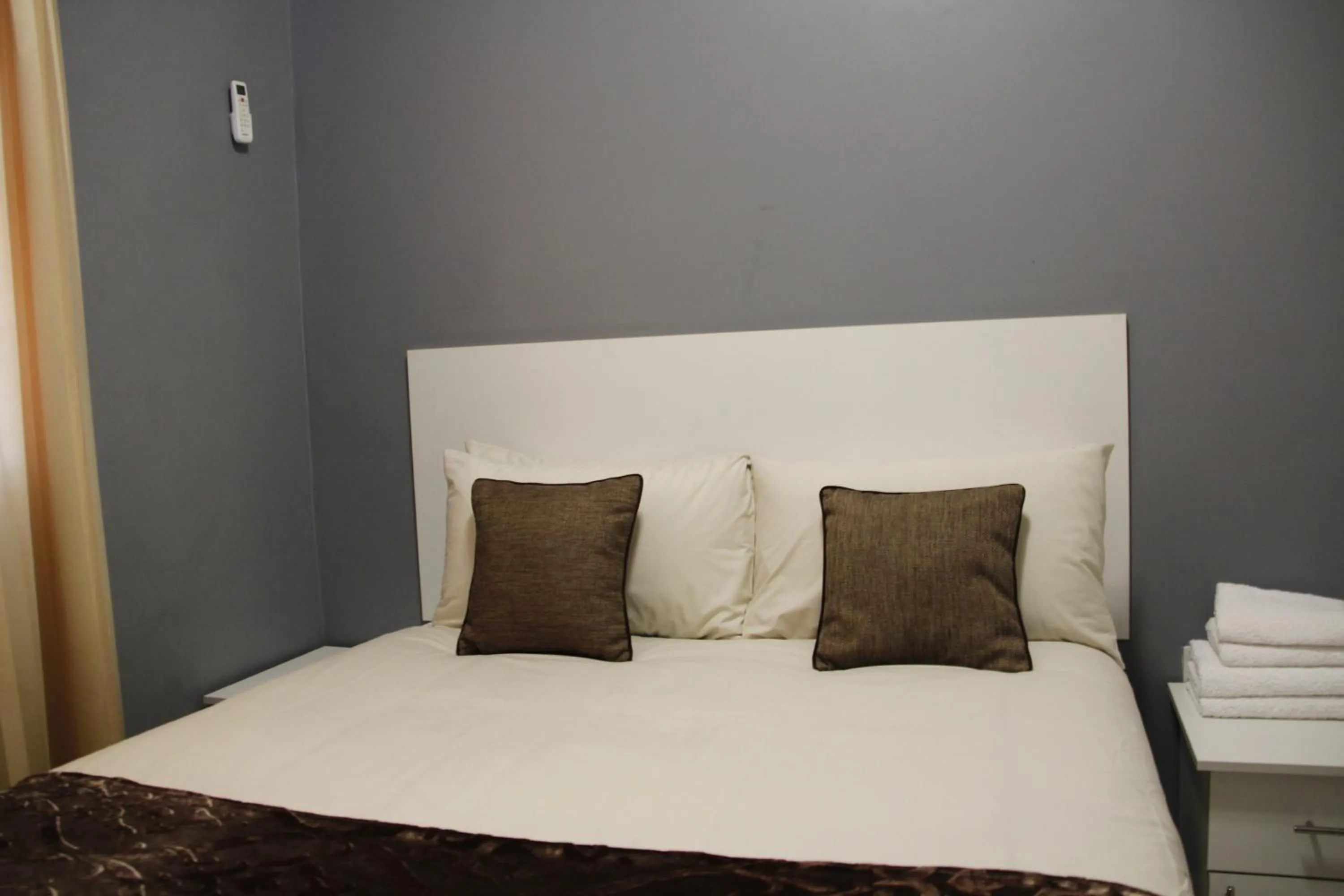 Bed in Asante Apartments