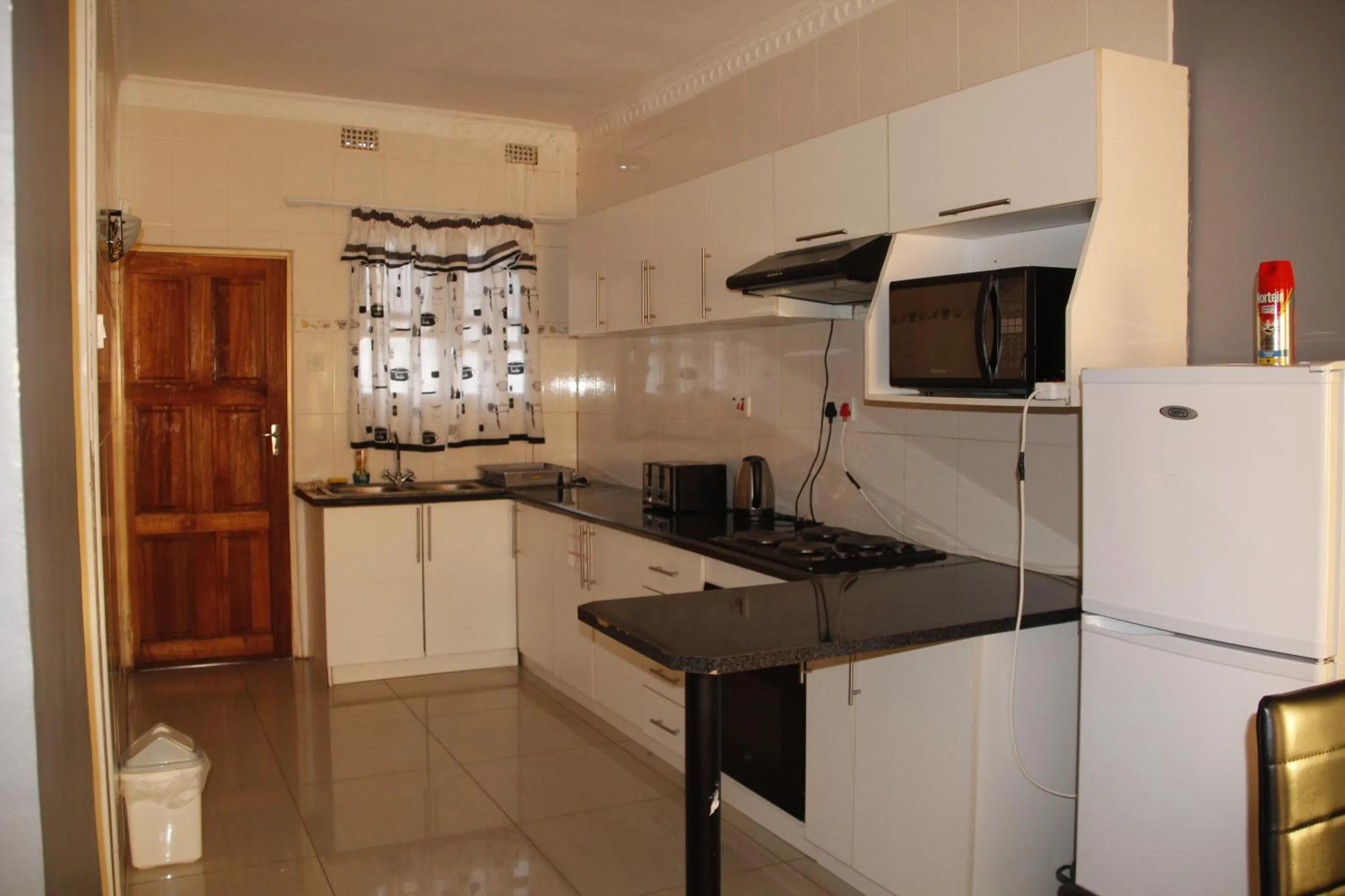 Kitchen or kitchenette in Asante Apartments