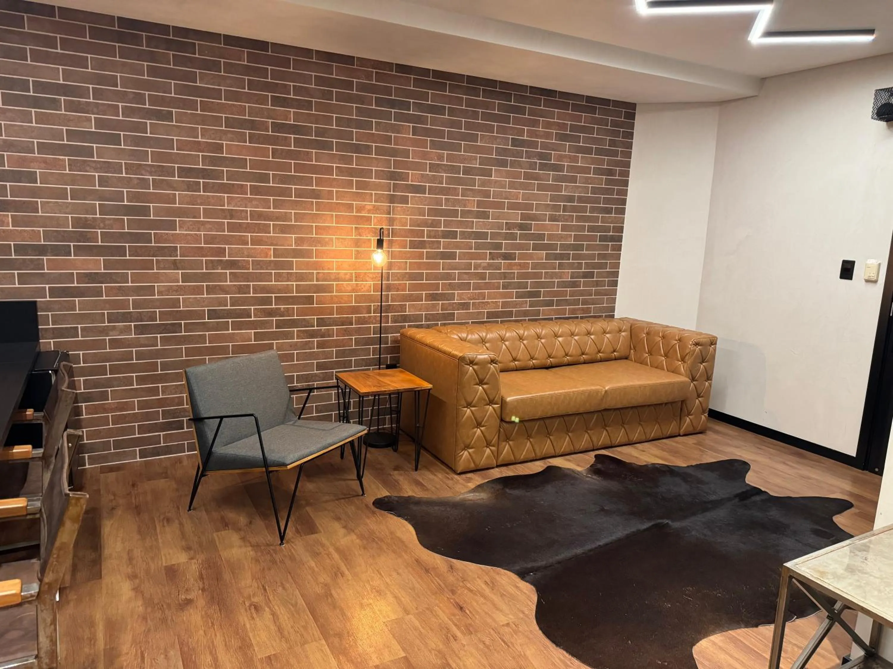 Living room in Mogano Premium Hotel - ELETROPOSTO