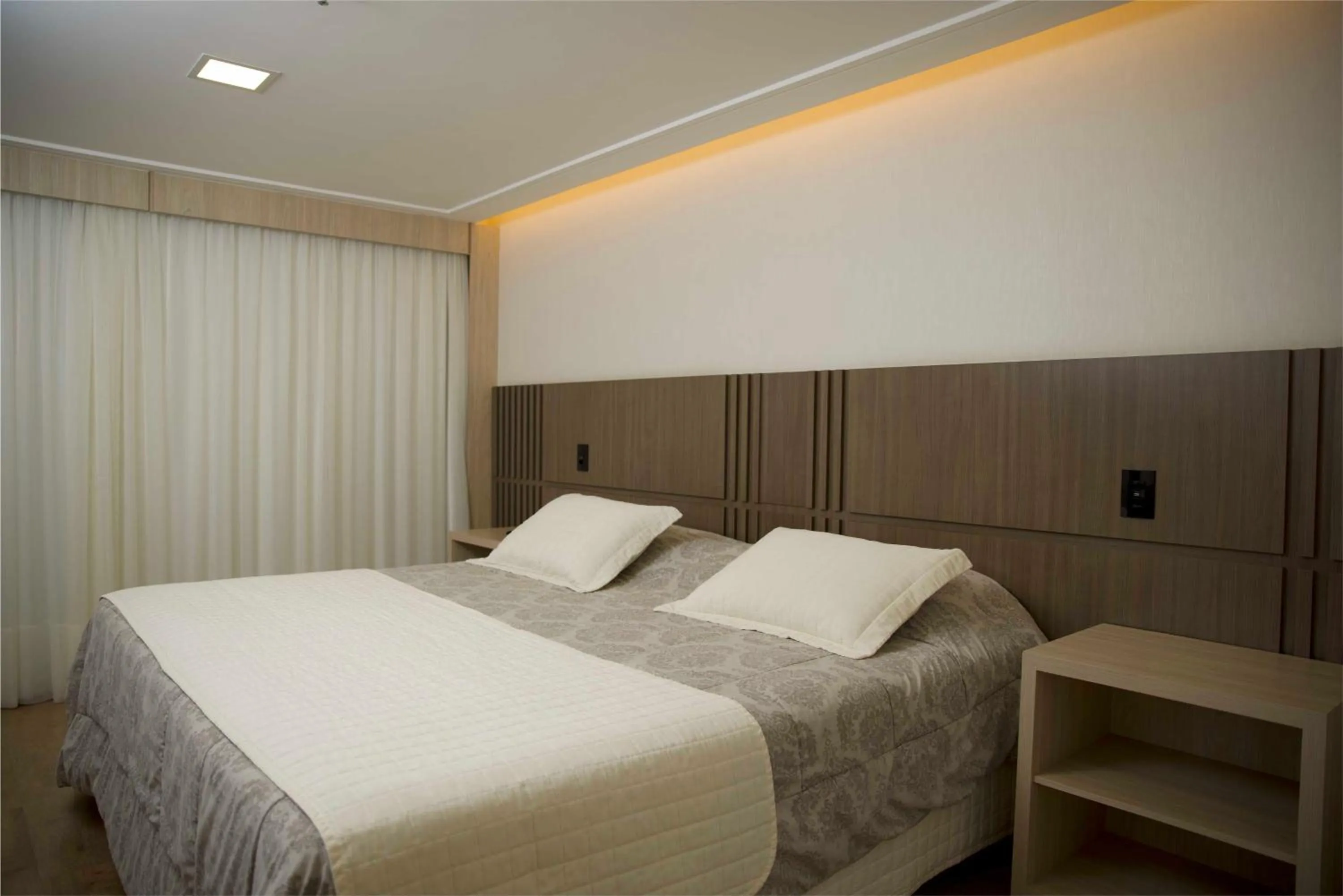 Bed in Mogano Premium Hotel - ELETROPOSTO