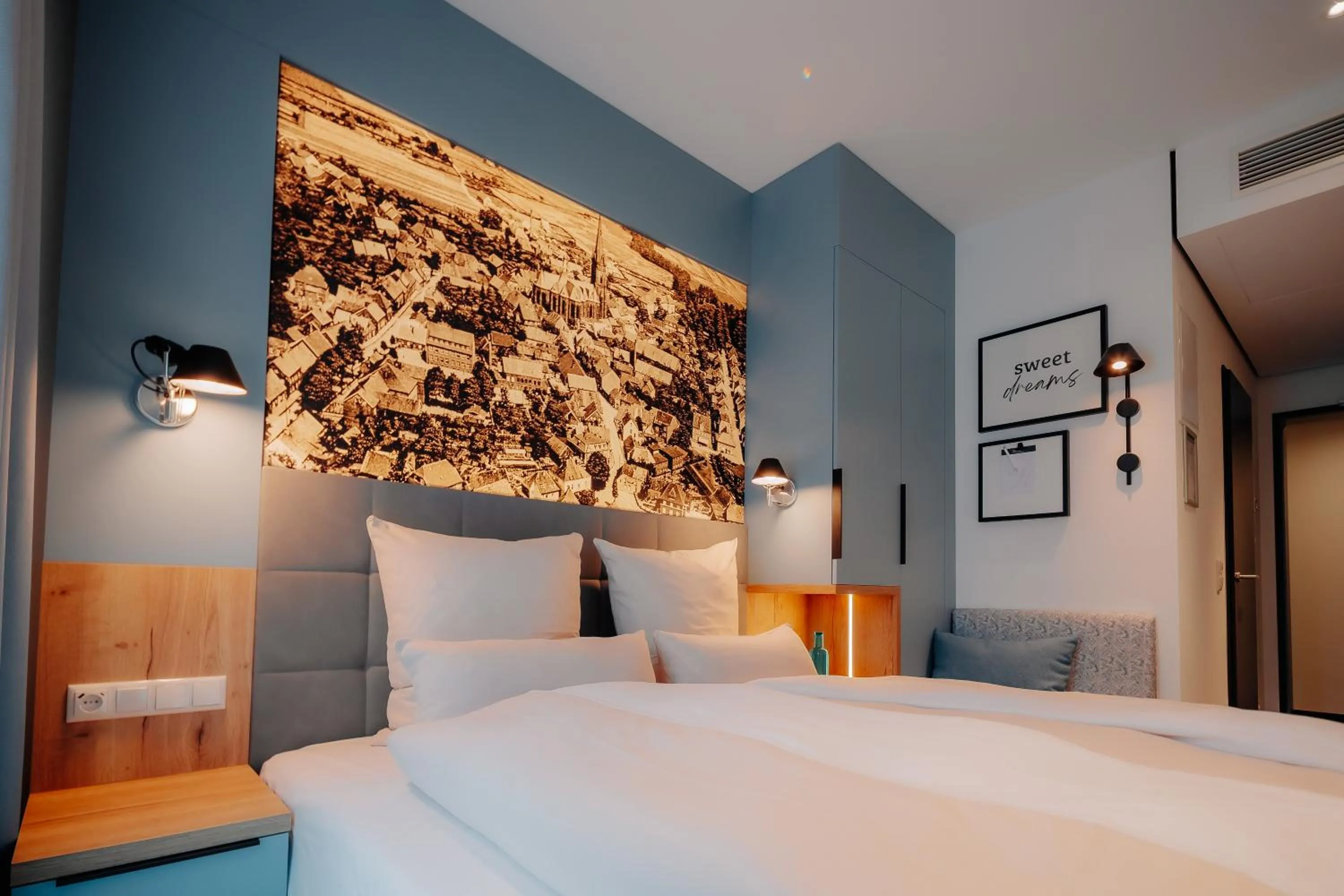 Photo of the whole room, Bed in Stadthöfe Rhede by Hackmann