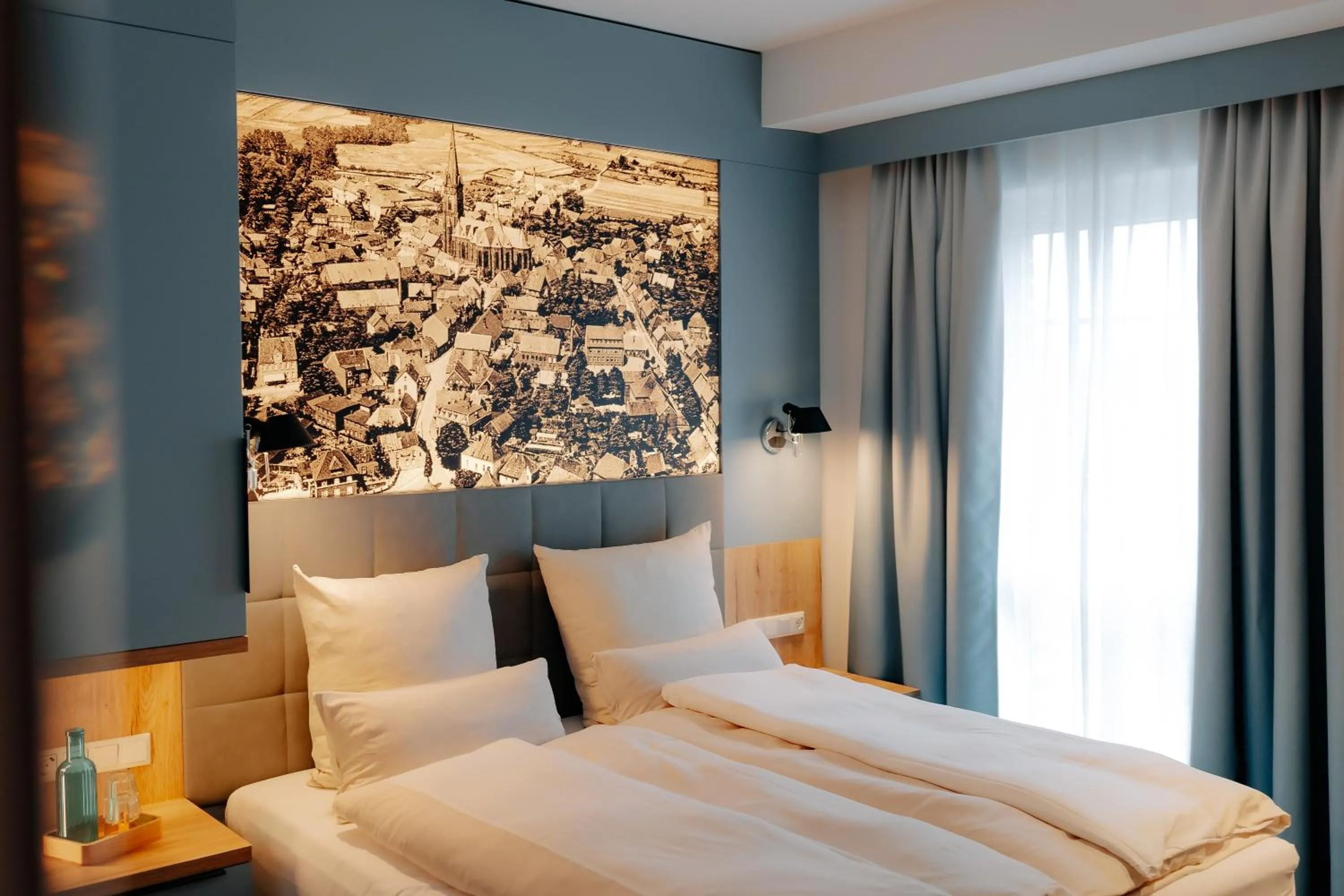 Photo of the whole room, Bed in Stadthöfe Rhede by Hackmann