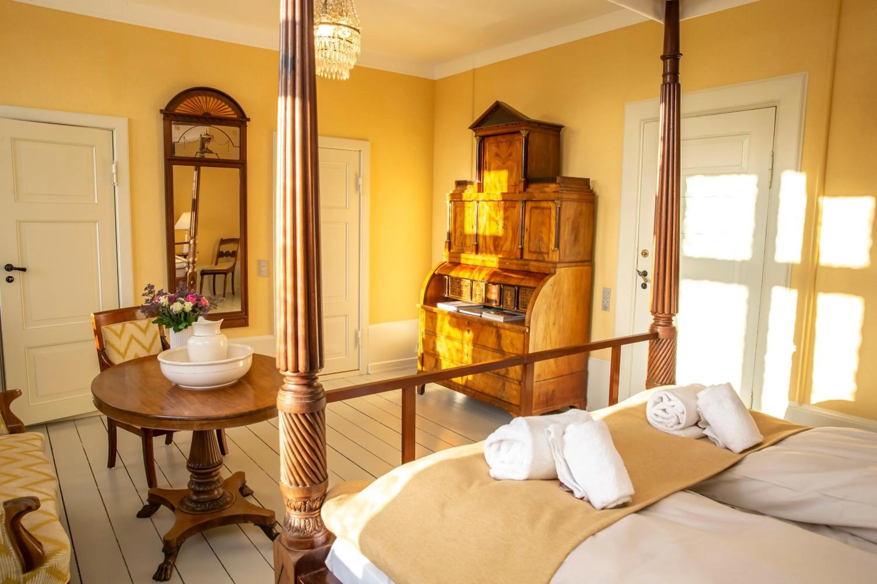 Seating area, Bed in Fuglsang Herregaard Hotel