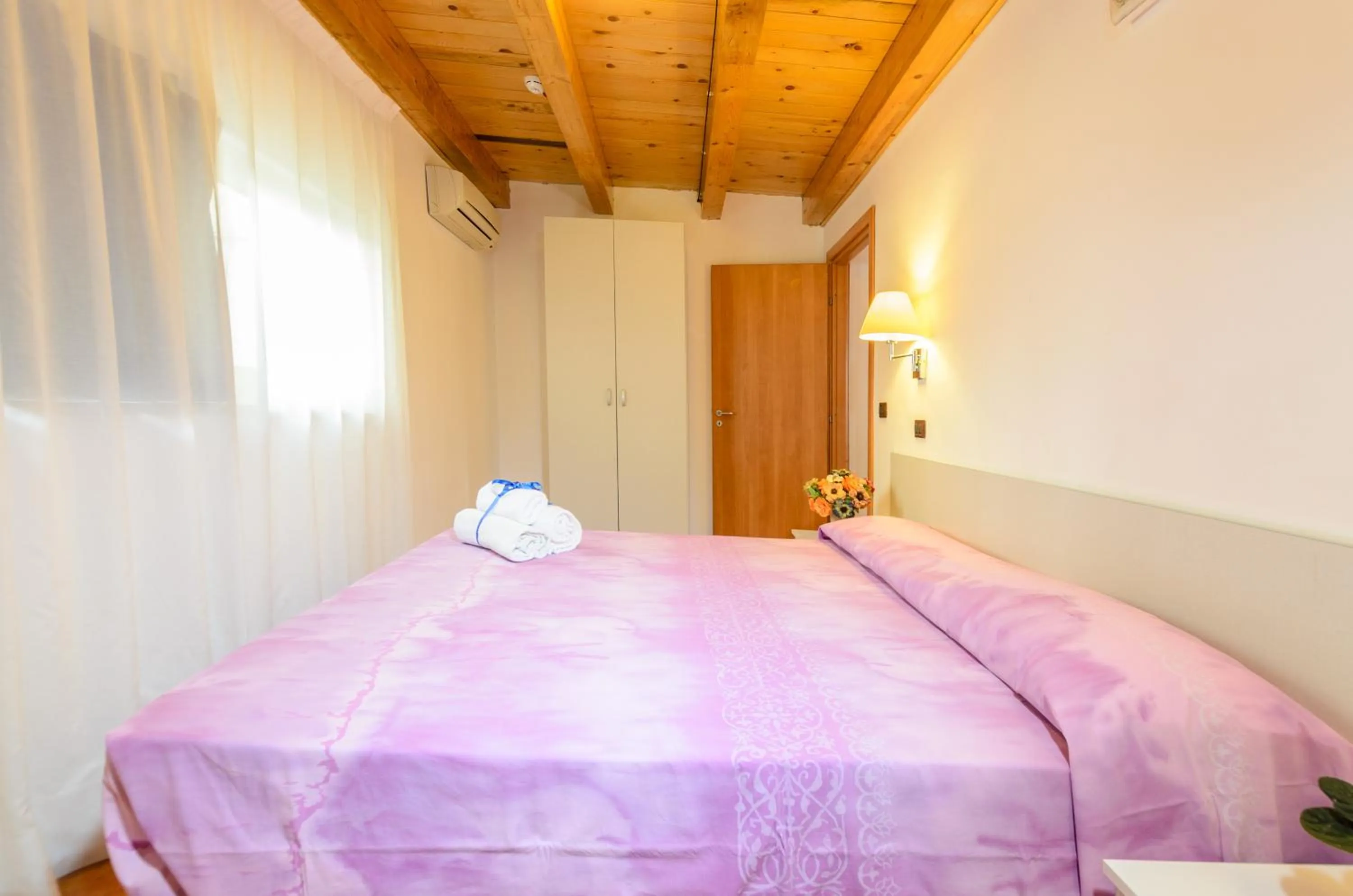 Bed in Le Tartarughe Aparthotel