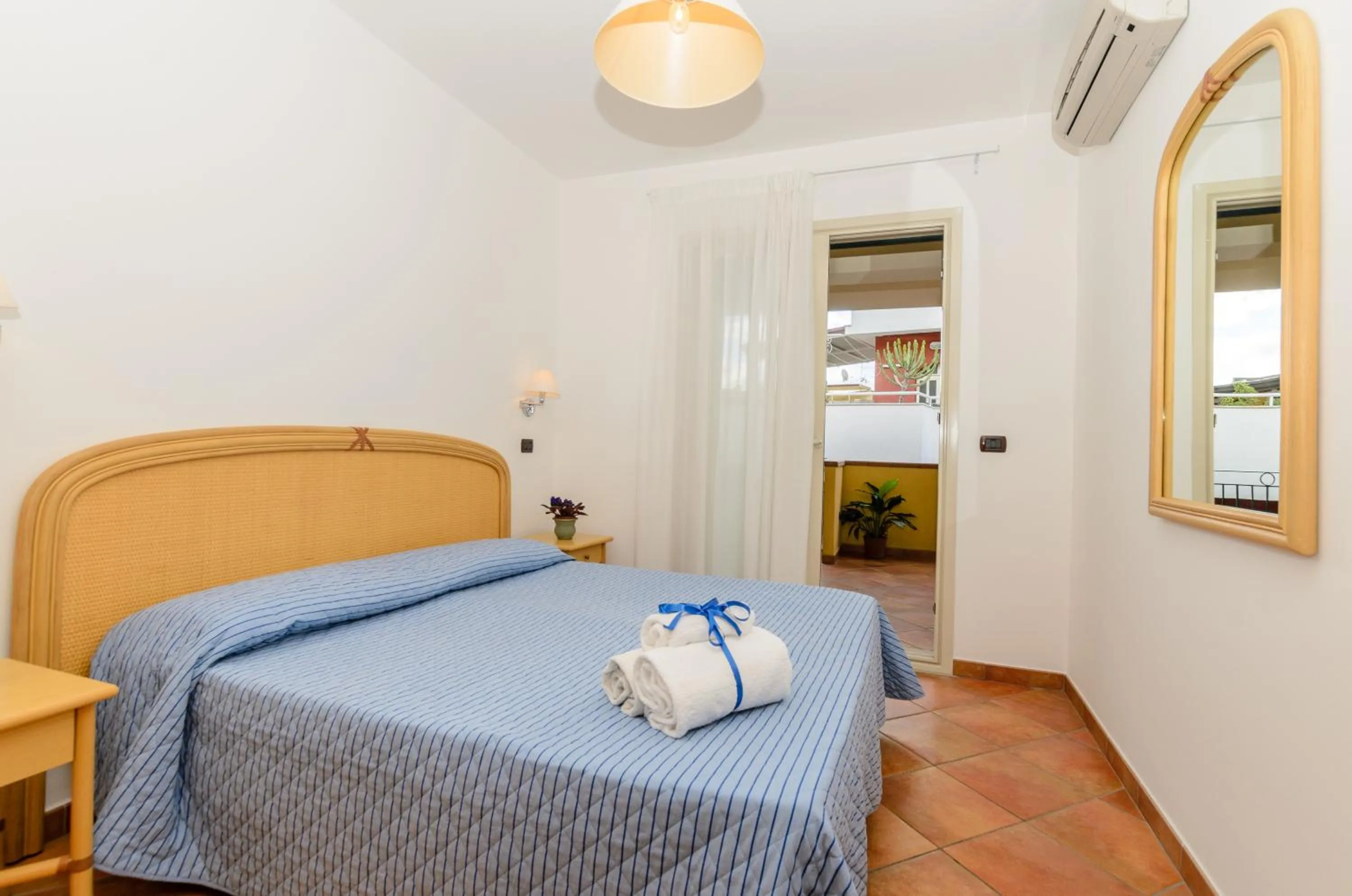 Bedroom in Le Tartarughe Aparthotel