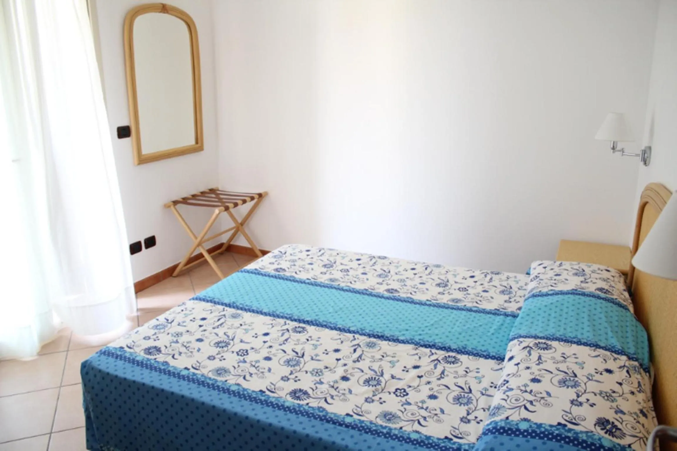 Bedroom in Le Tartarughe Aparthotel