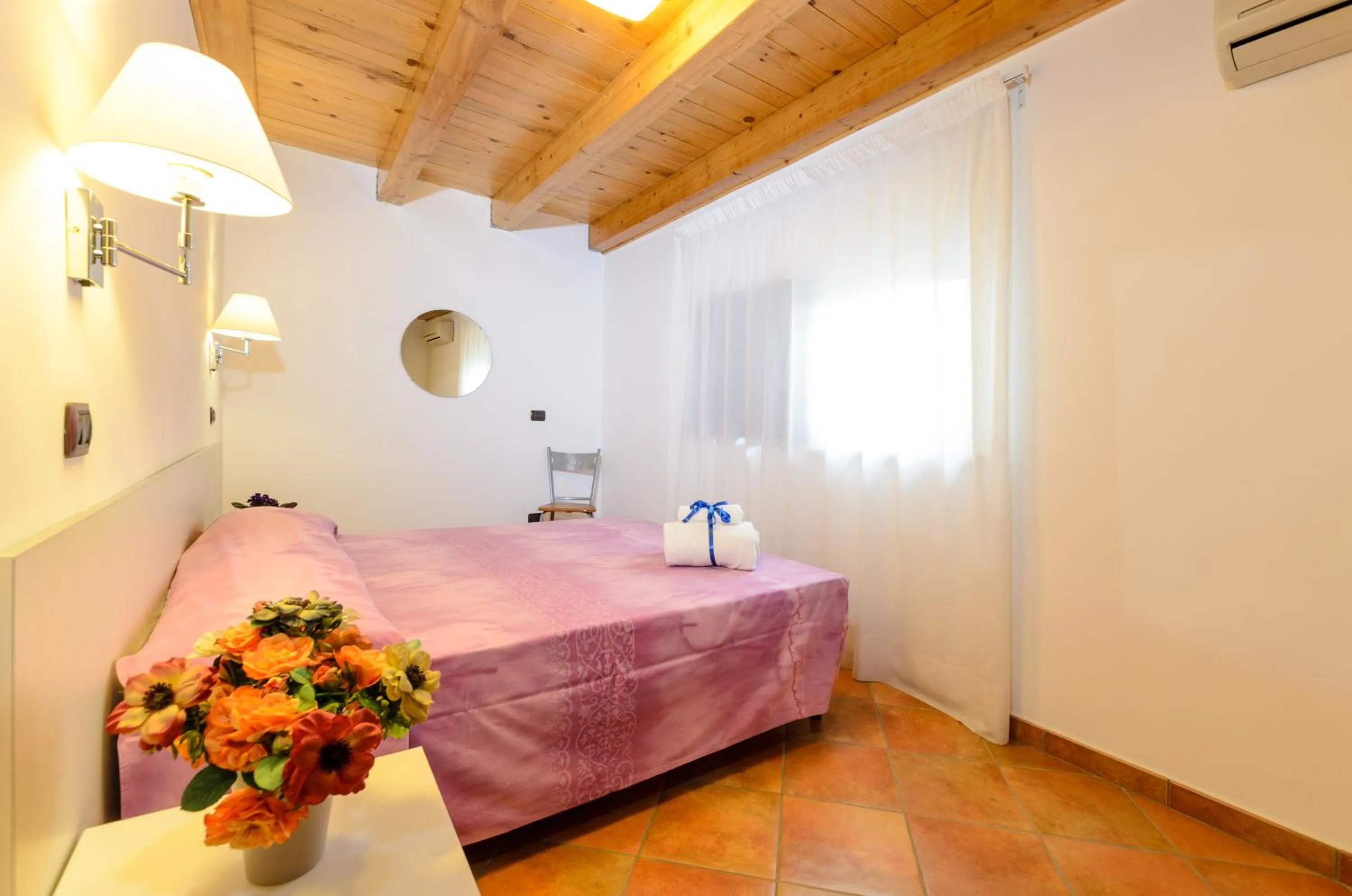 Bed in Le Tartarughe Aparthotel