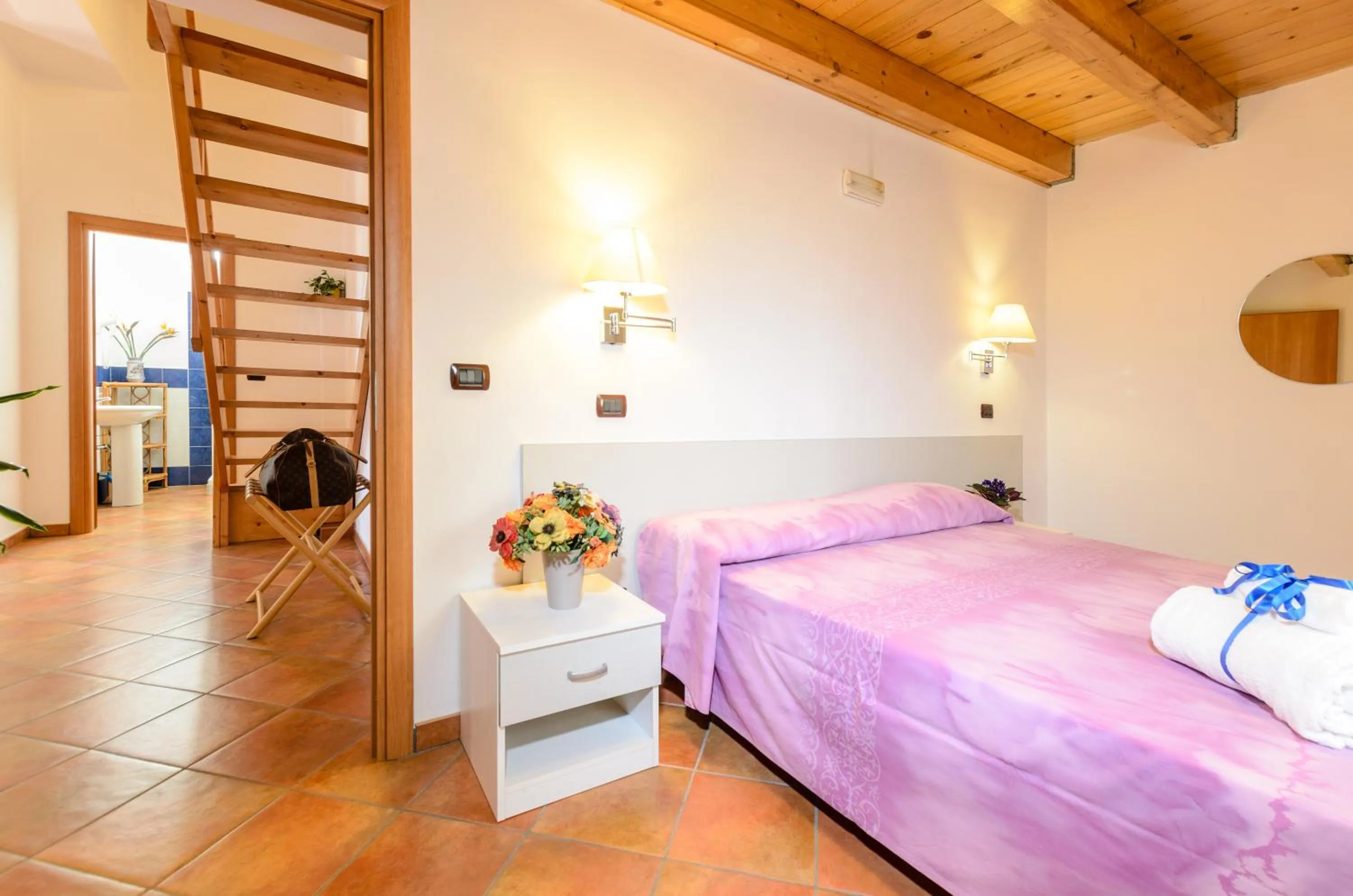 Bed in Le Tartarughe Aparthotel