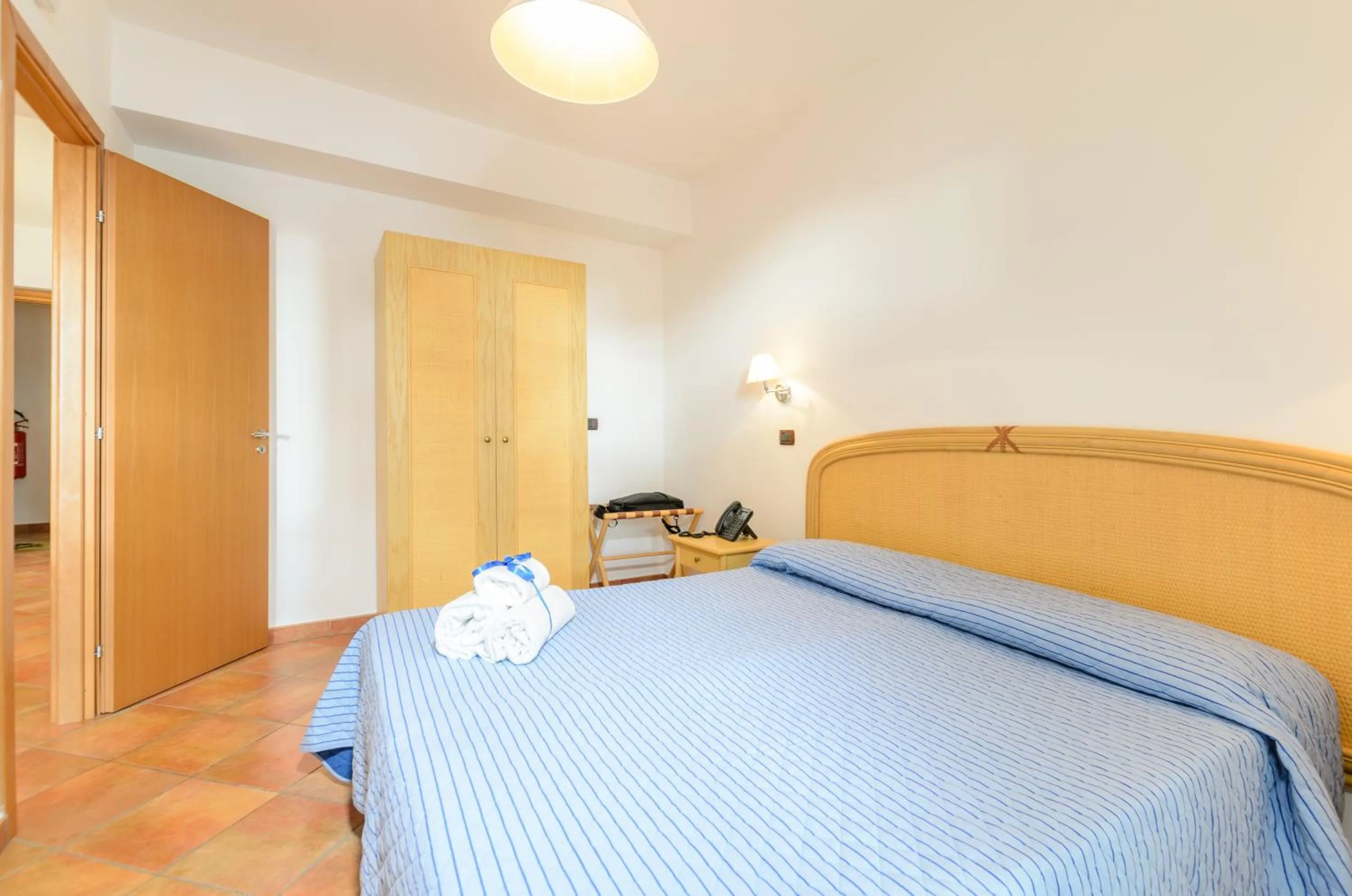 Bedroom in Le Tartarughe Aparthotel