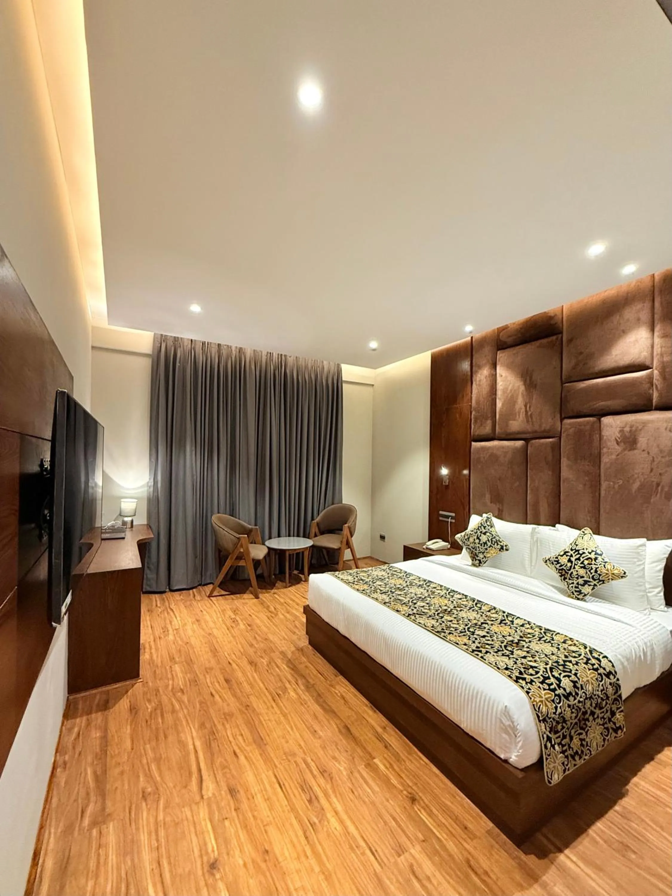 Seating area, Bed in The Olive Hotel Srinagar