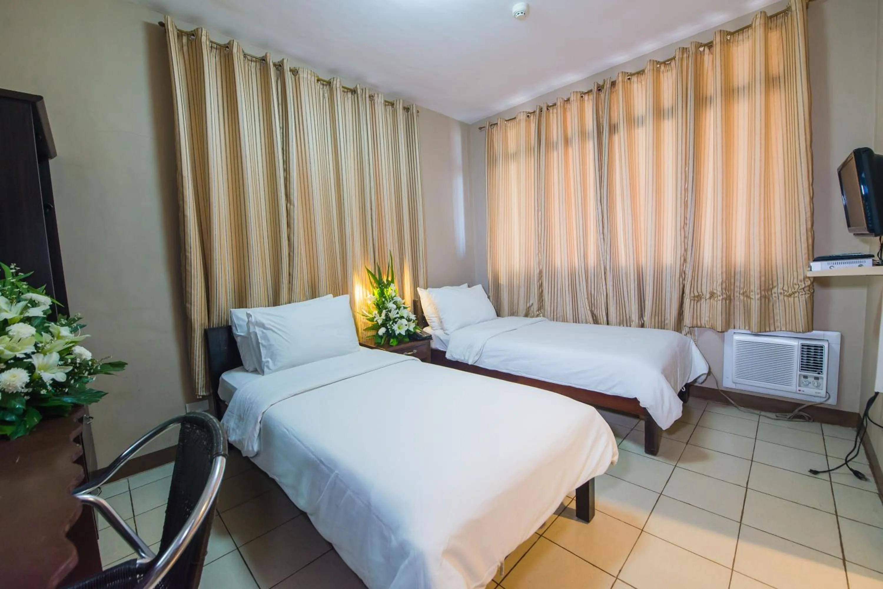 Bed in Northland Resort Hotel Manapla