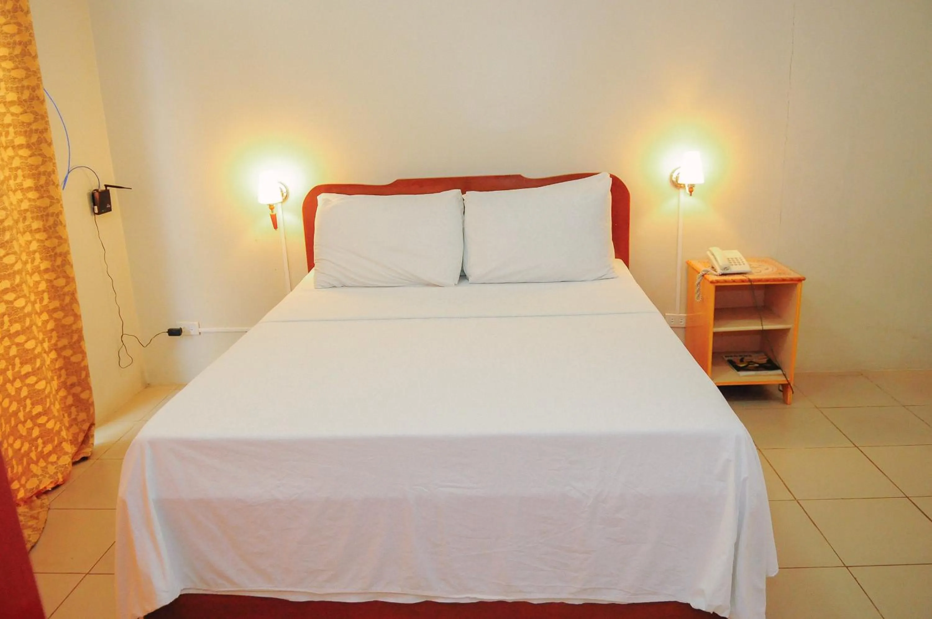 Bed in Northland Resort Hotel Manapla