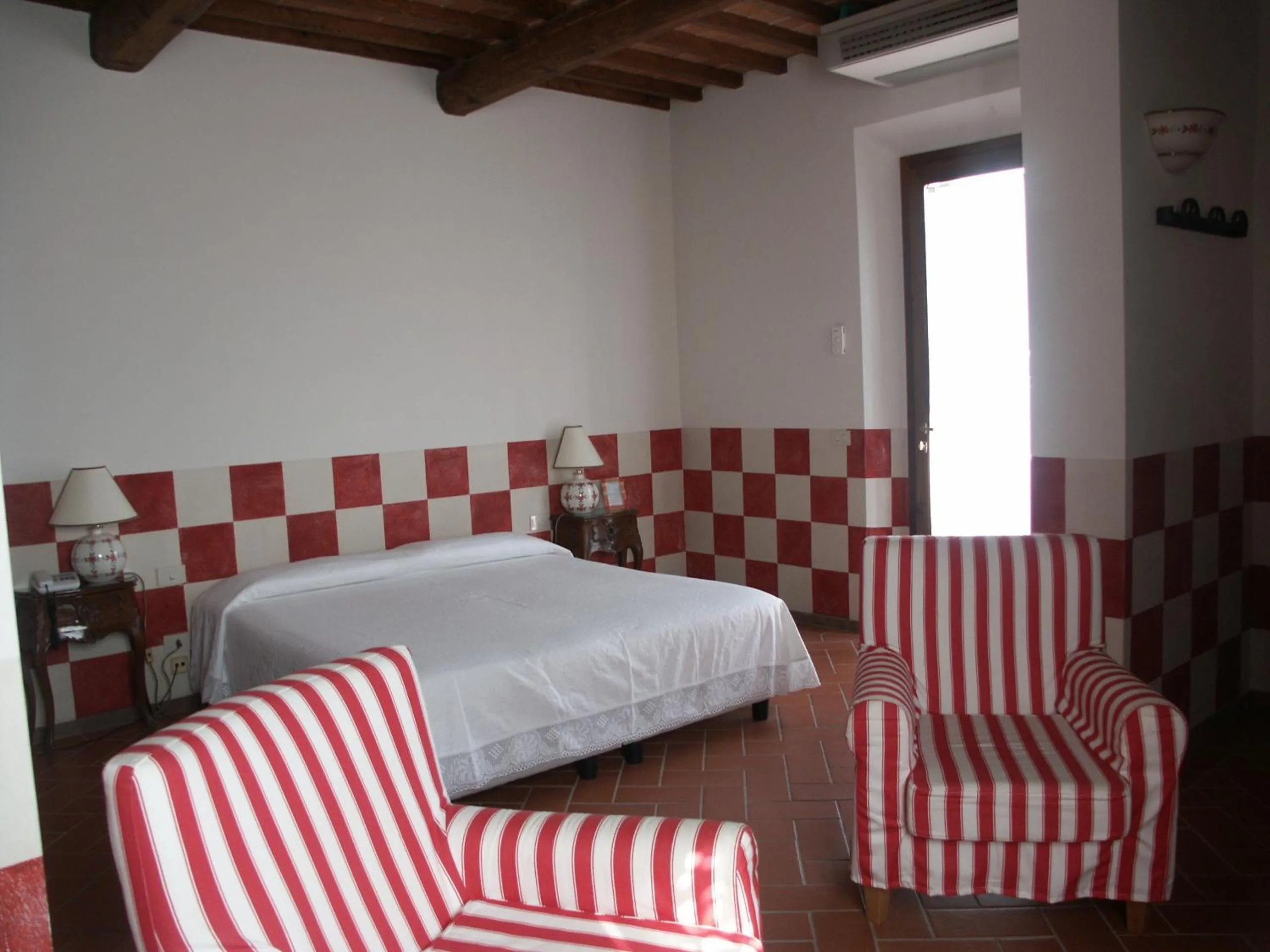 Photo of the whole room in Locanda le Boscarecce