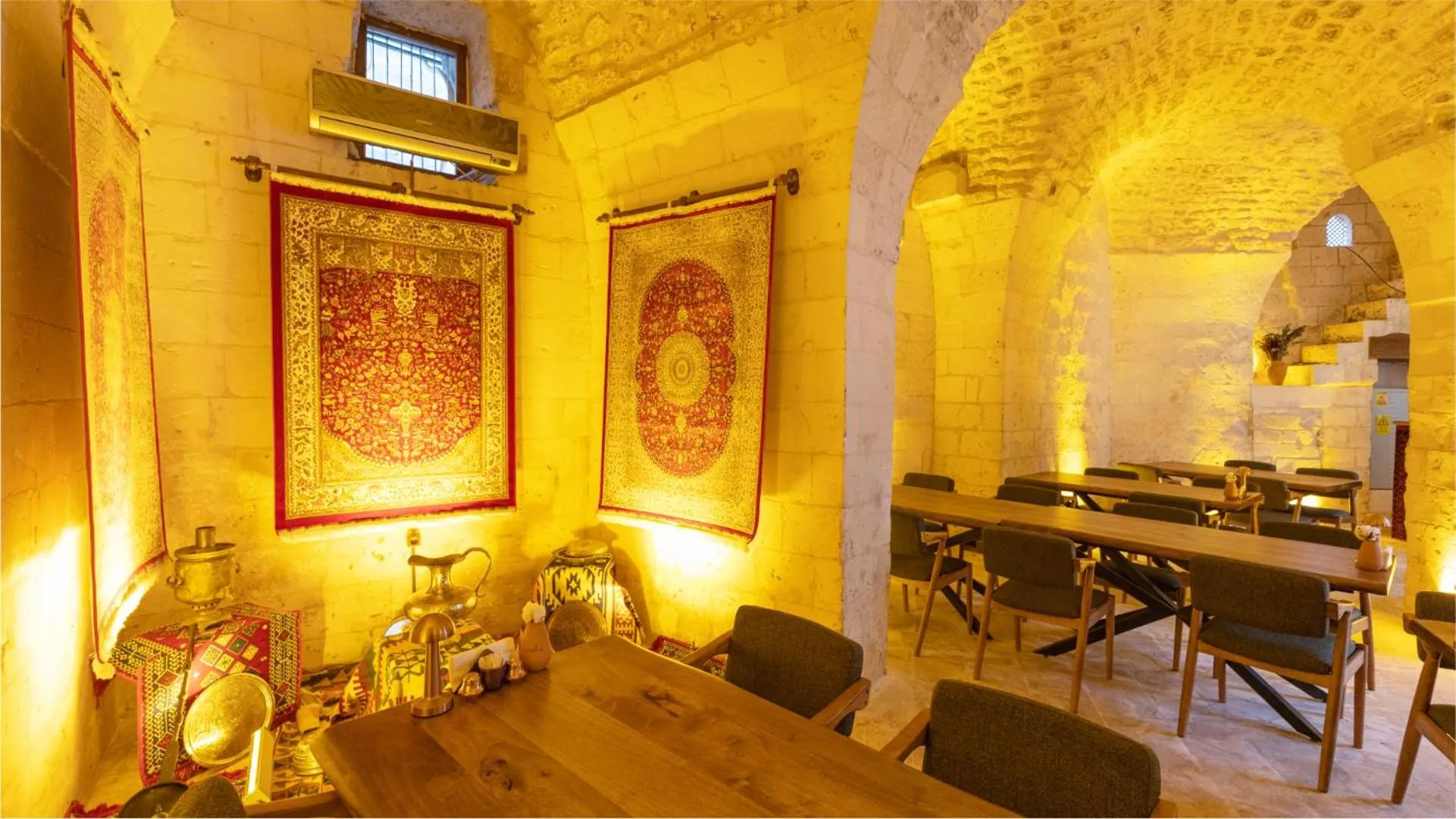 Seating area in Stone House by Cevahir
