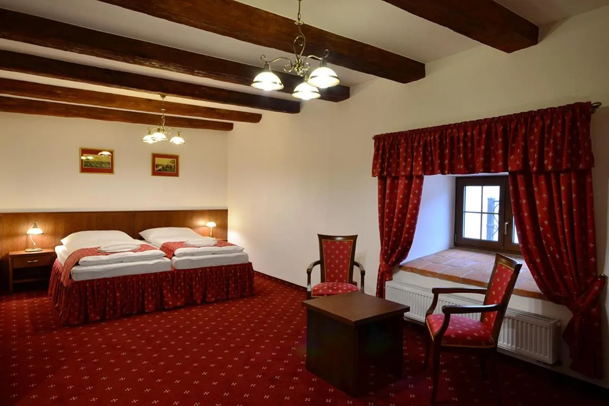 Bed in Hotel Malý Pivovar