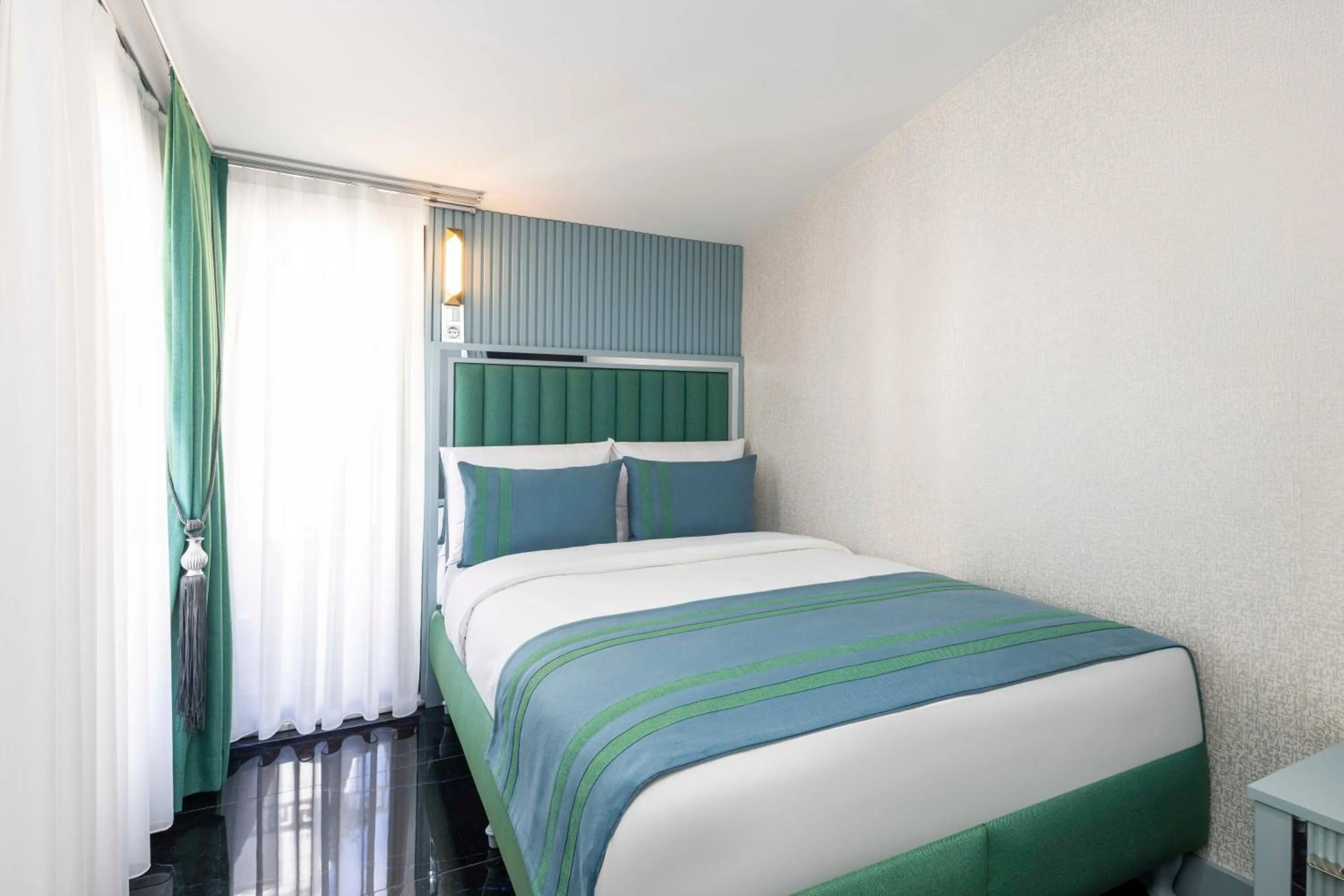 Bed in Santa Rio Gold Taxim Hotel