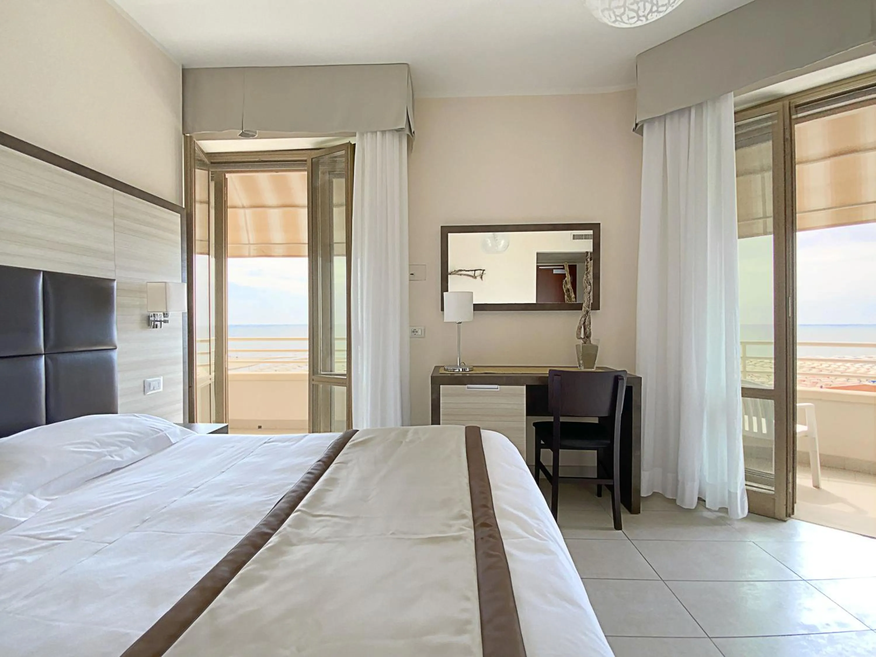 Bed in Hotel Capri & Residence