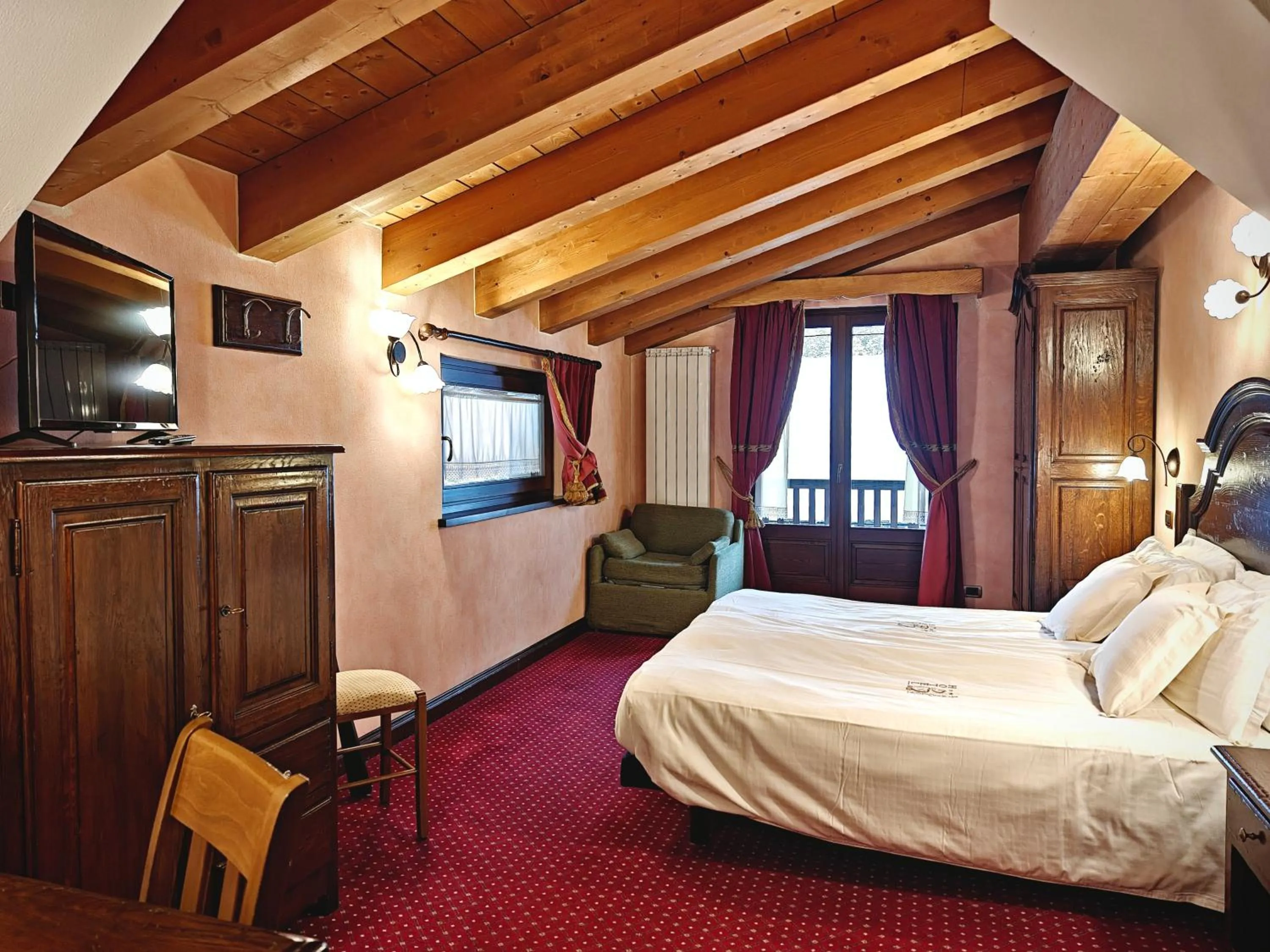 Bed in Hotel L' Aiglon