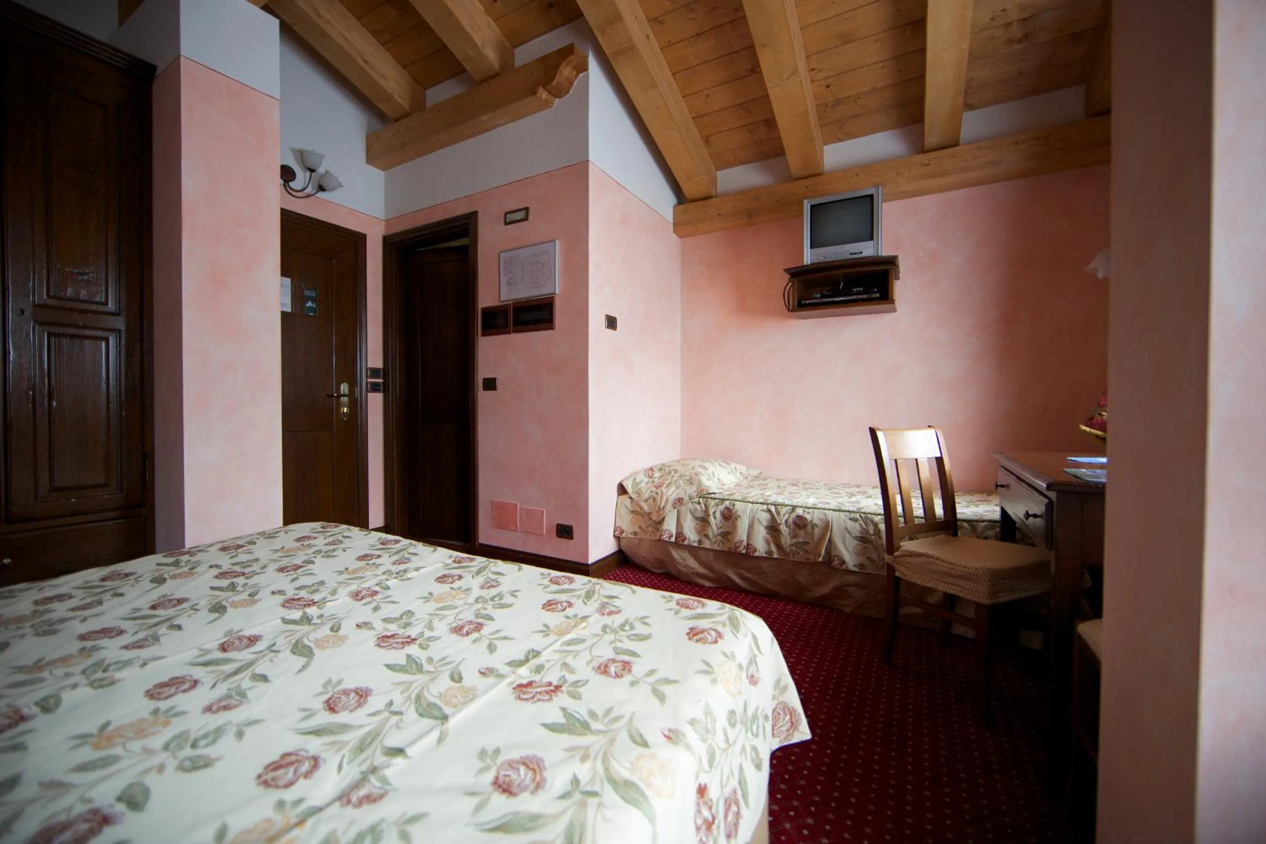 Bed in Hotel L' Aiglon