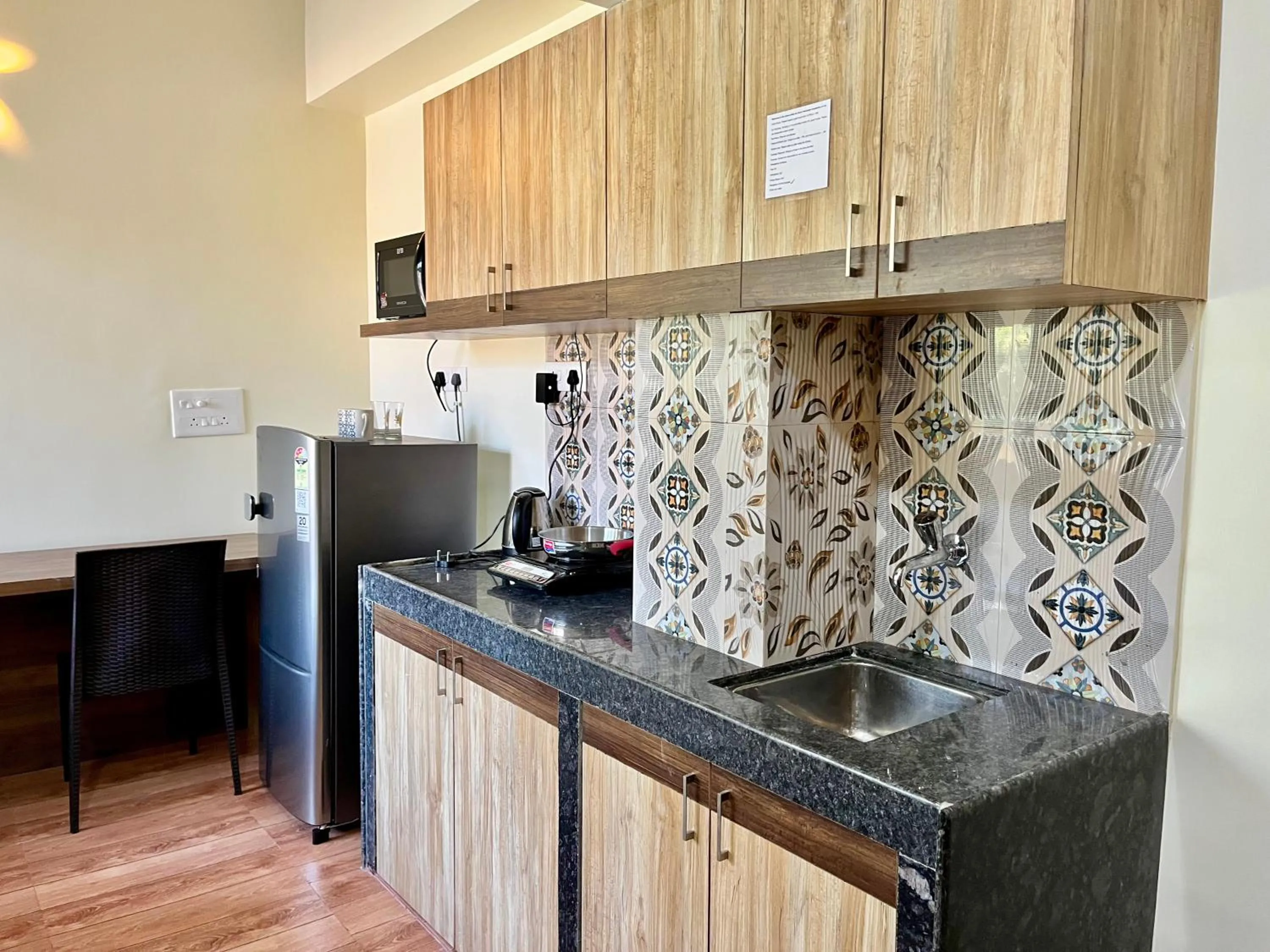Kitchen or kitchenette in Lykke Suites- 2-min Drive to Colva Beach-By Goan Felicidade Hospitality PVT LTD
