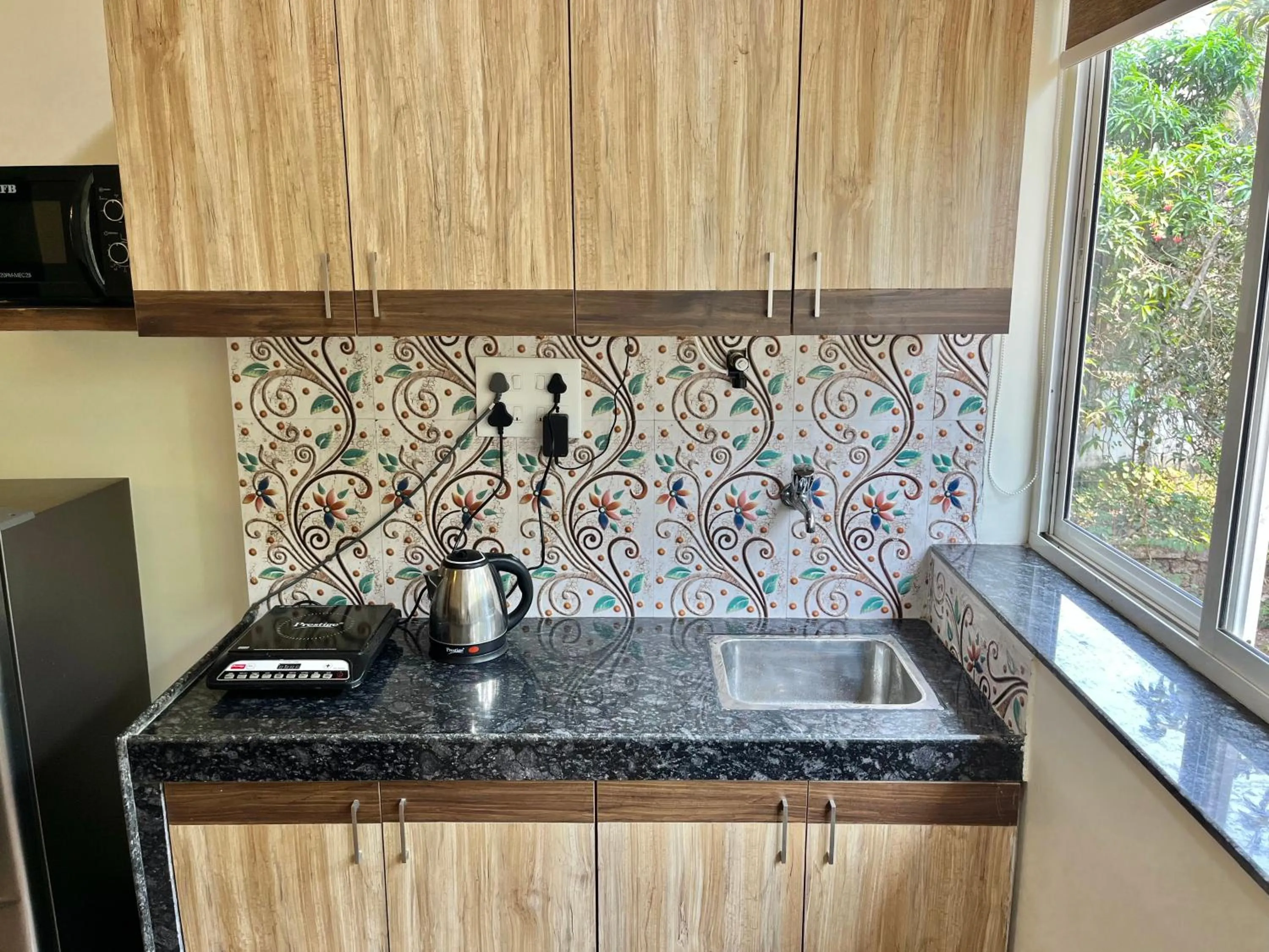 Kitchen or kitchenette in Lykke Suites- 2-min Drive to Colva Beach-By Goan Felicidade Hospitality PVT LTD