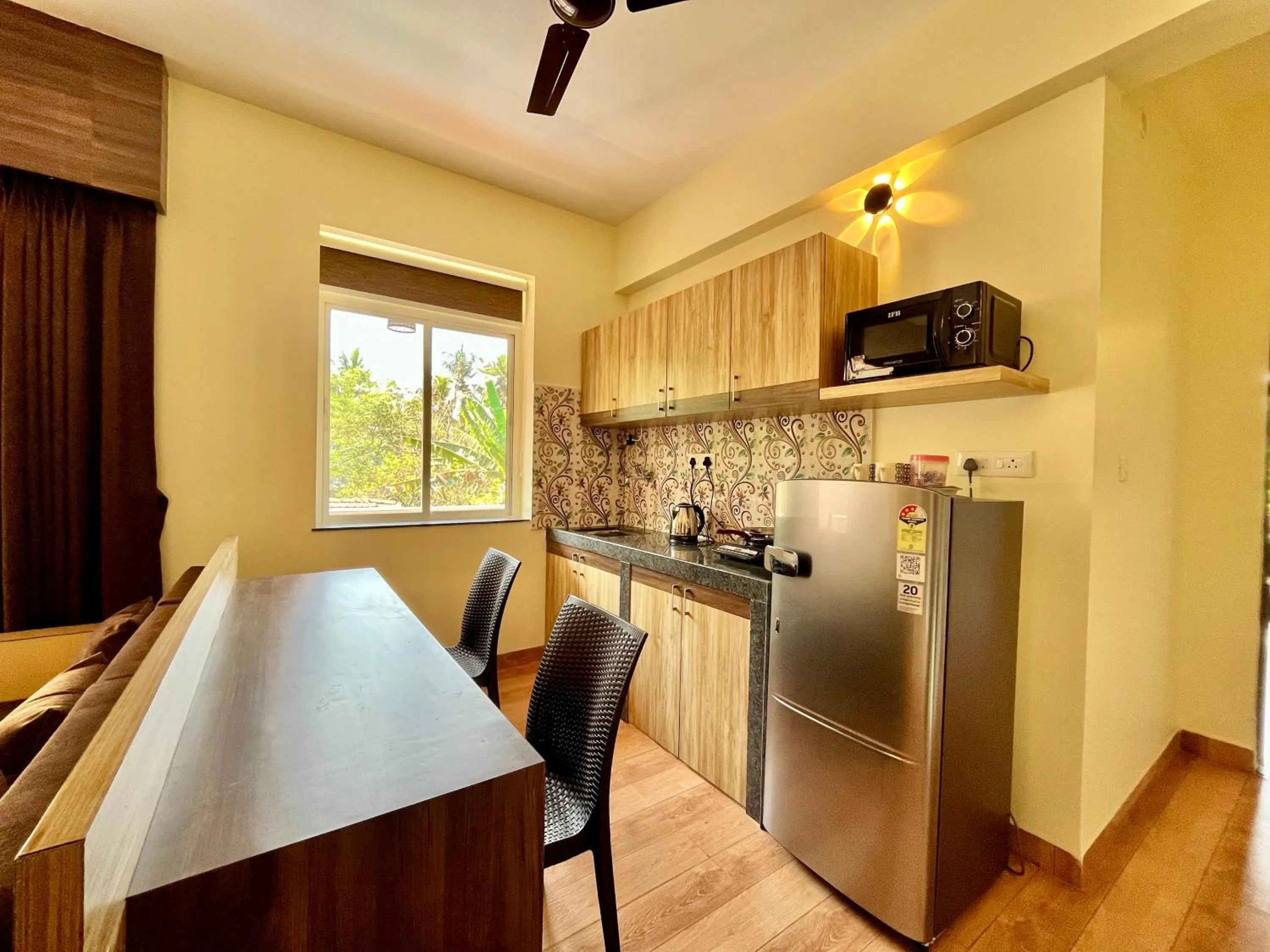 Kitchen or kitchenette in Lykke Suites- 2-min Drive to Colva Beach-By Goan Felicidade Hospitality PVT LTD