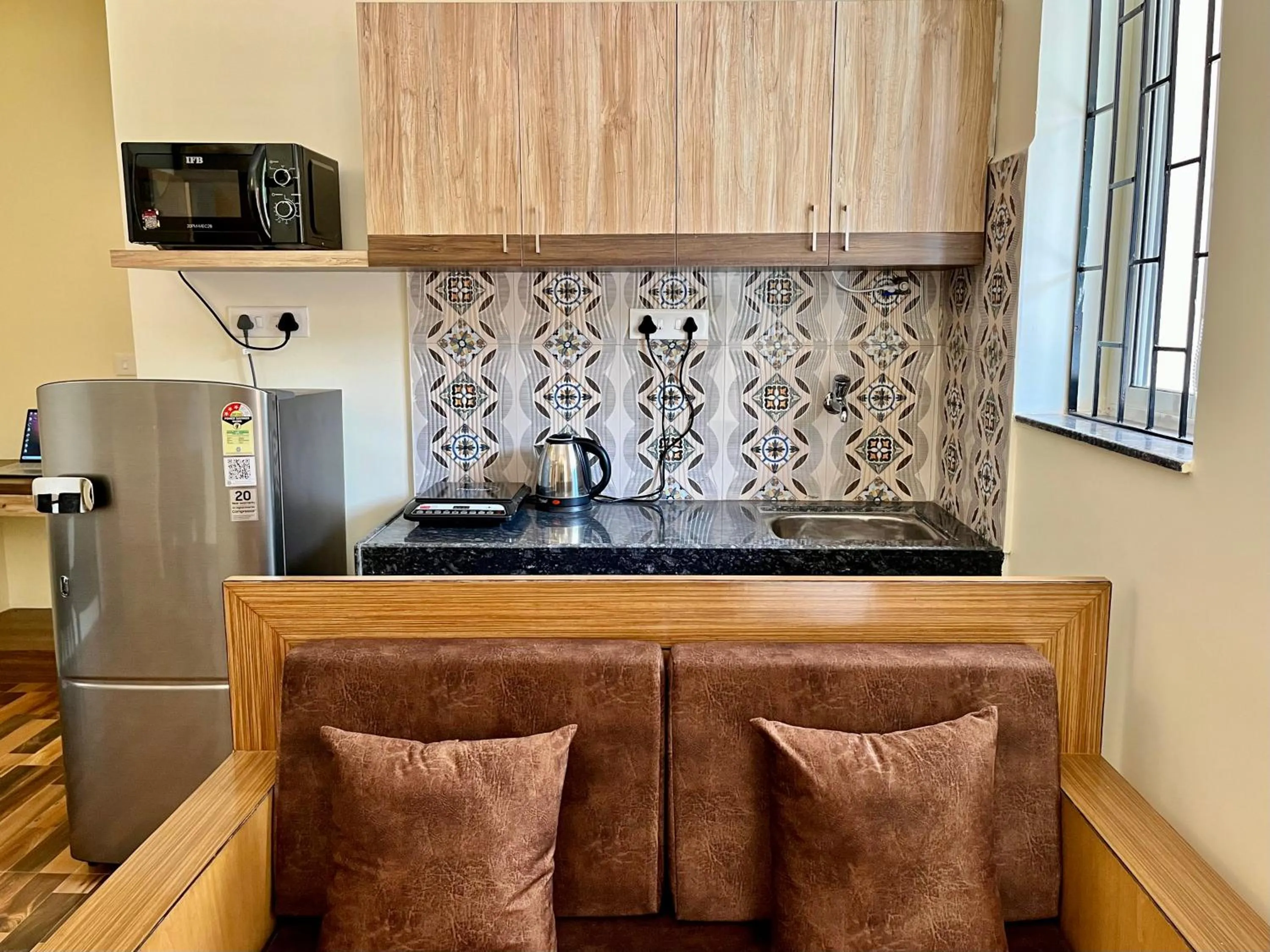 stove in Lykke Suites- 2-min Drive to Colva Beach-By Goan Felicidade Hospitality PVT LTD