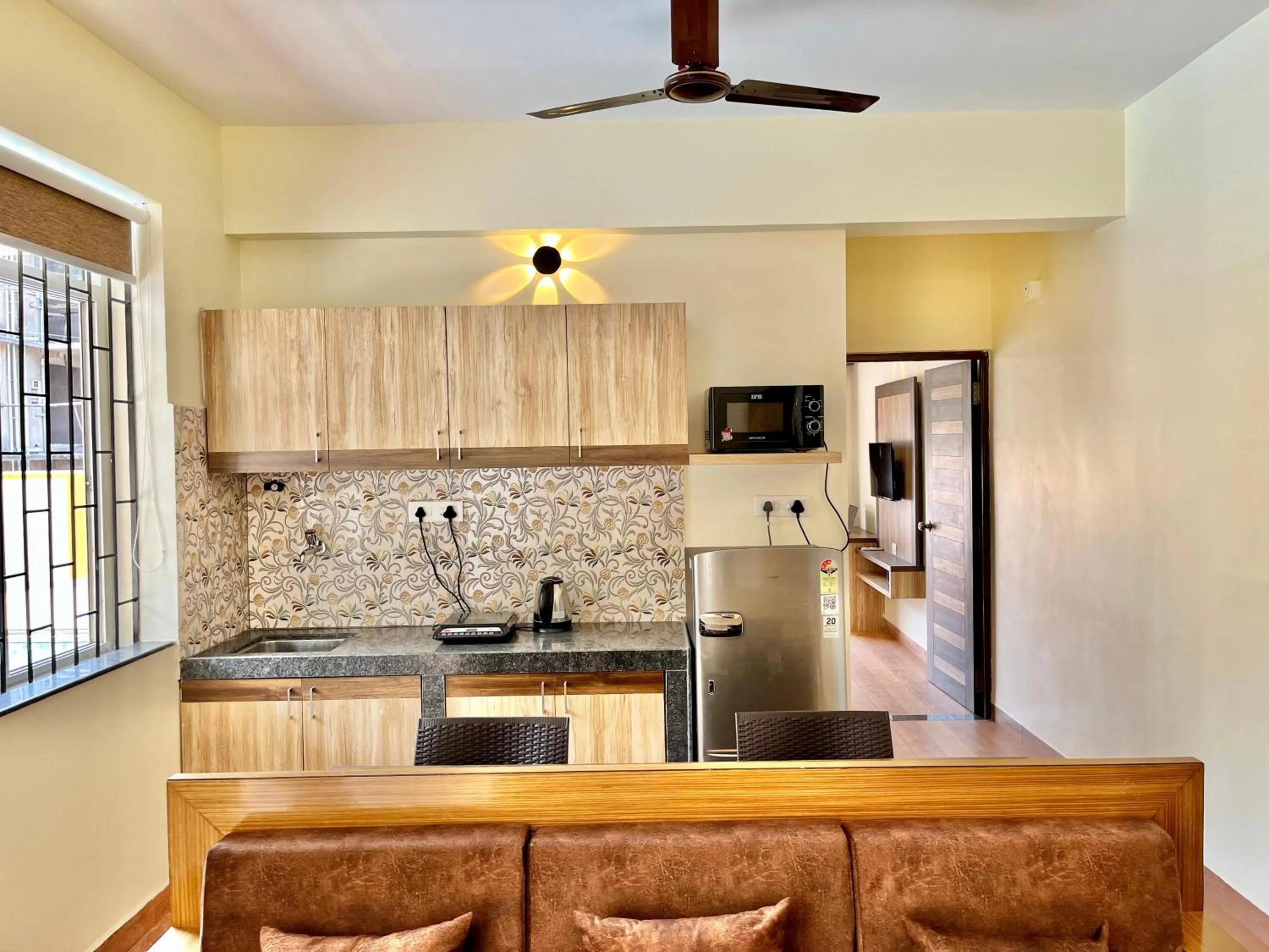 Kitchen or kitchenette in Lykke Suites- 2-min Drive to Colva Beach-By Goan Felicidade Hospitality PVT LTD