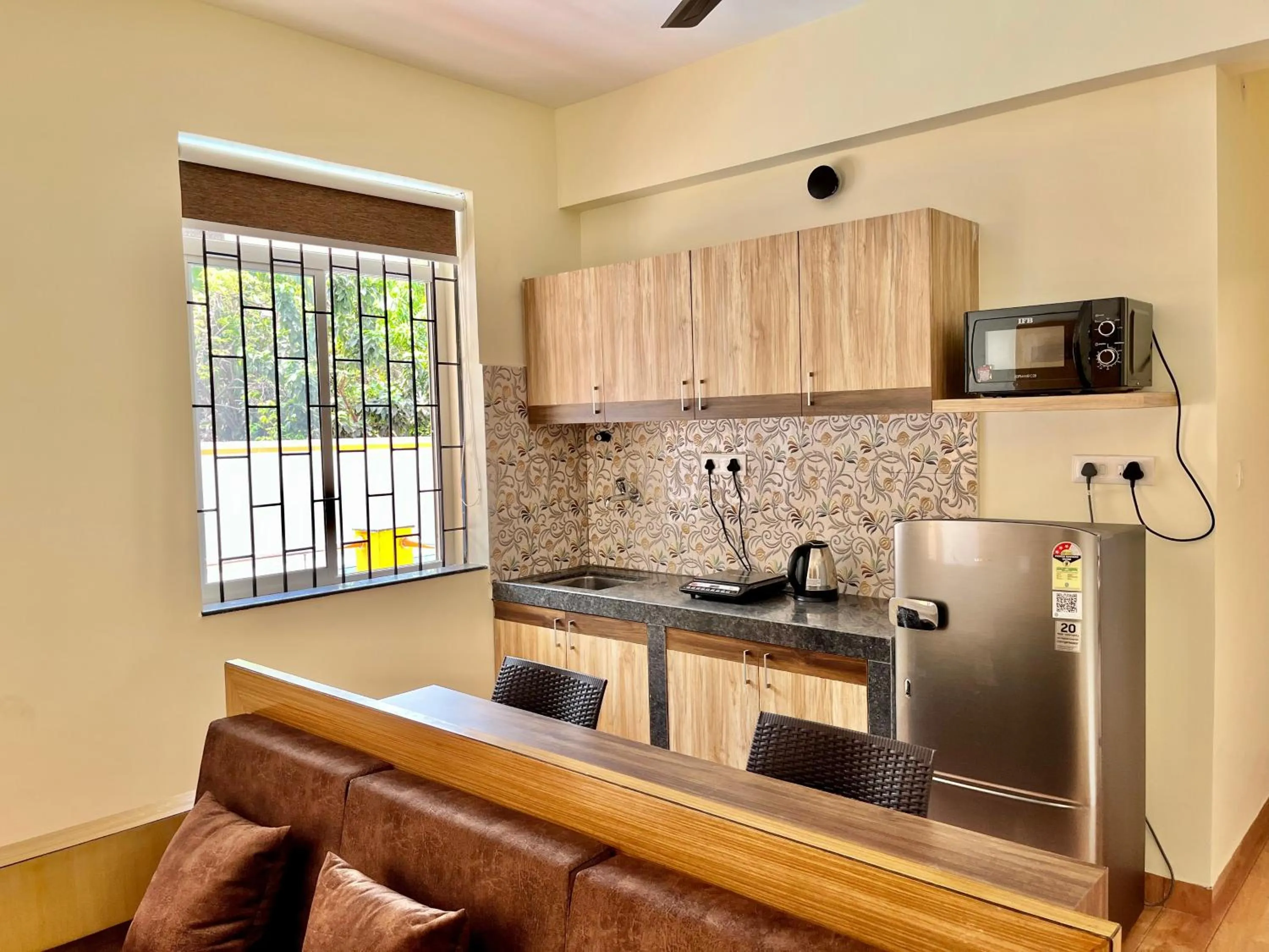 Kitchen or kitchenette in Lykke Suites- 2-min Drive to Colva Beach-By Goan Felicidade Hospitality PVT LTD