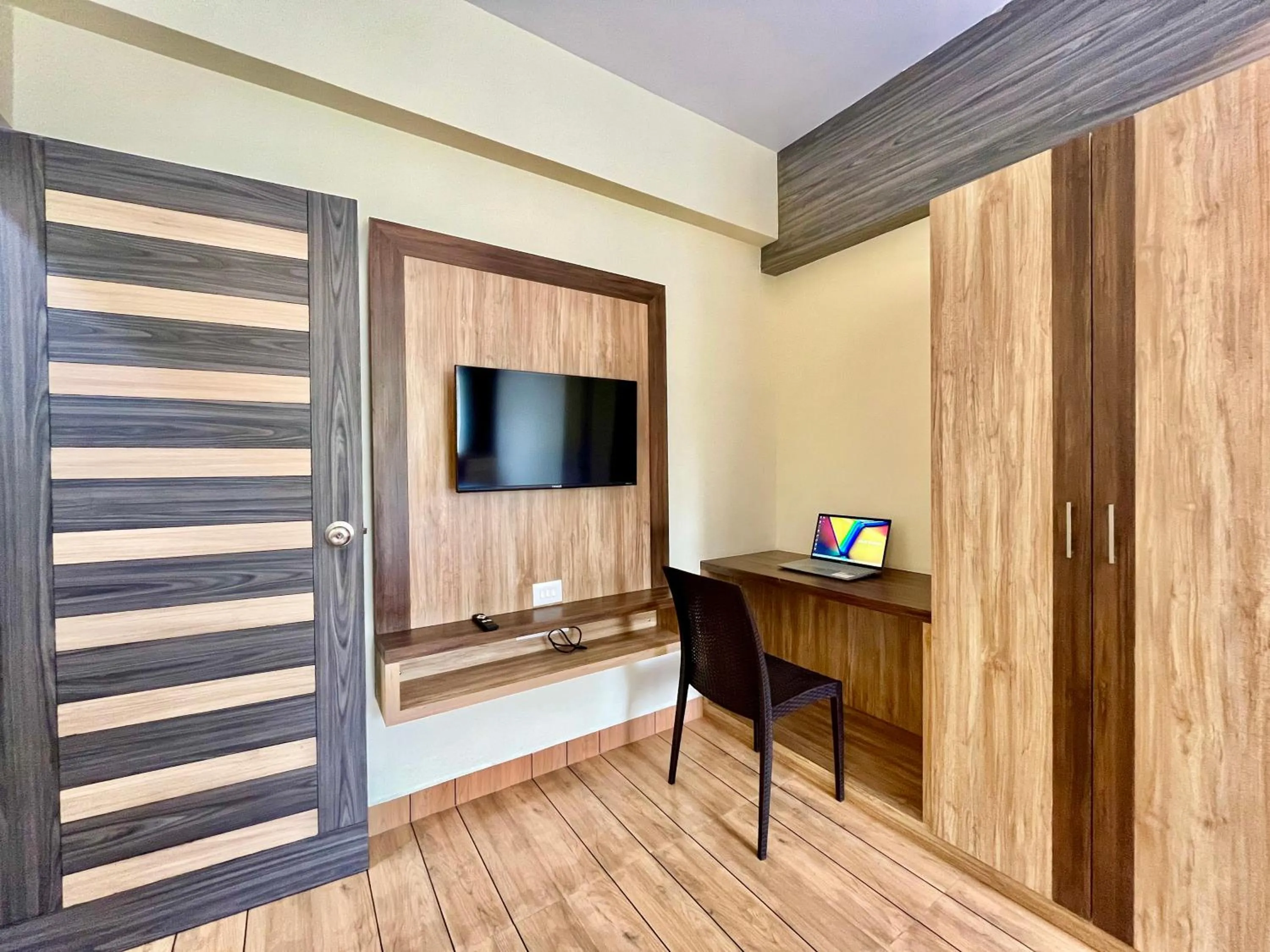 TV and multimedia in Lykke Suites- 2-min Drive to Colva Beach-By Goan Felicidade Hospitality PVT LTD