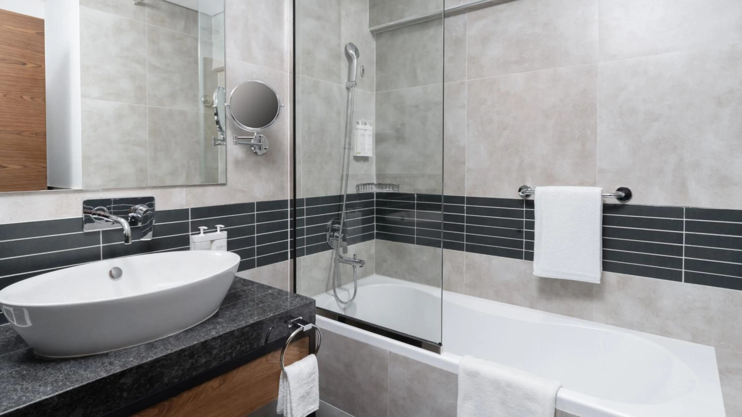 Bathroom in Holiday Inn Dubai Village Circle by IHG