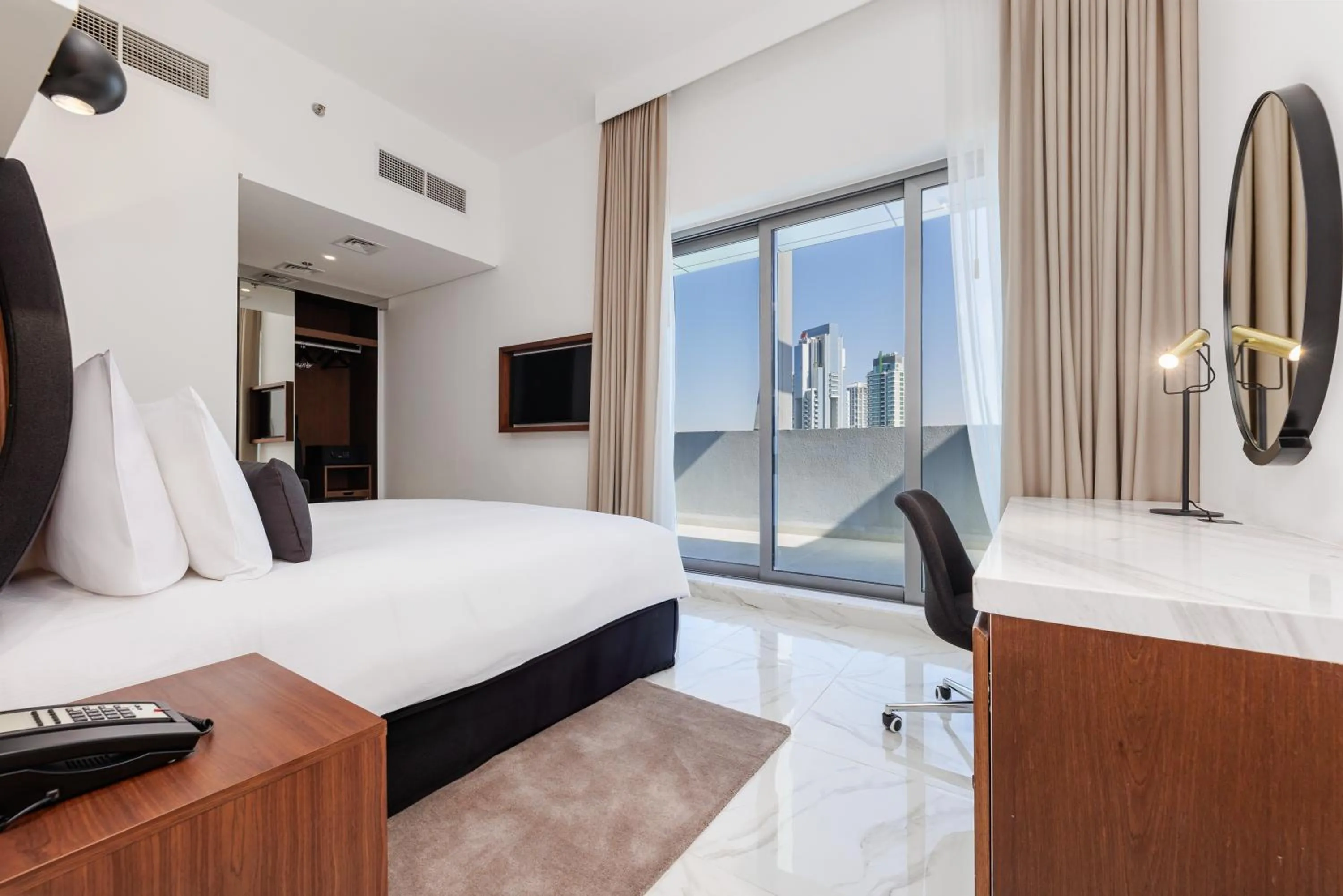 Photo of the whole room, Bed in Holiday Inn Dubai Village Circle by IHG