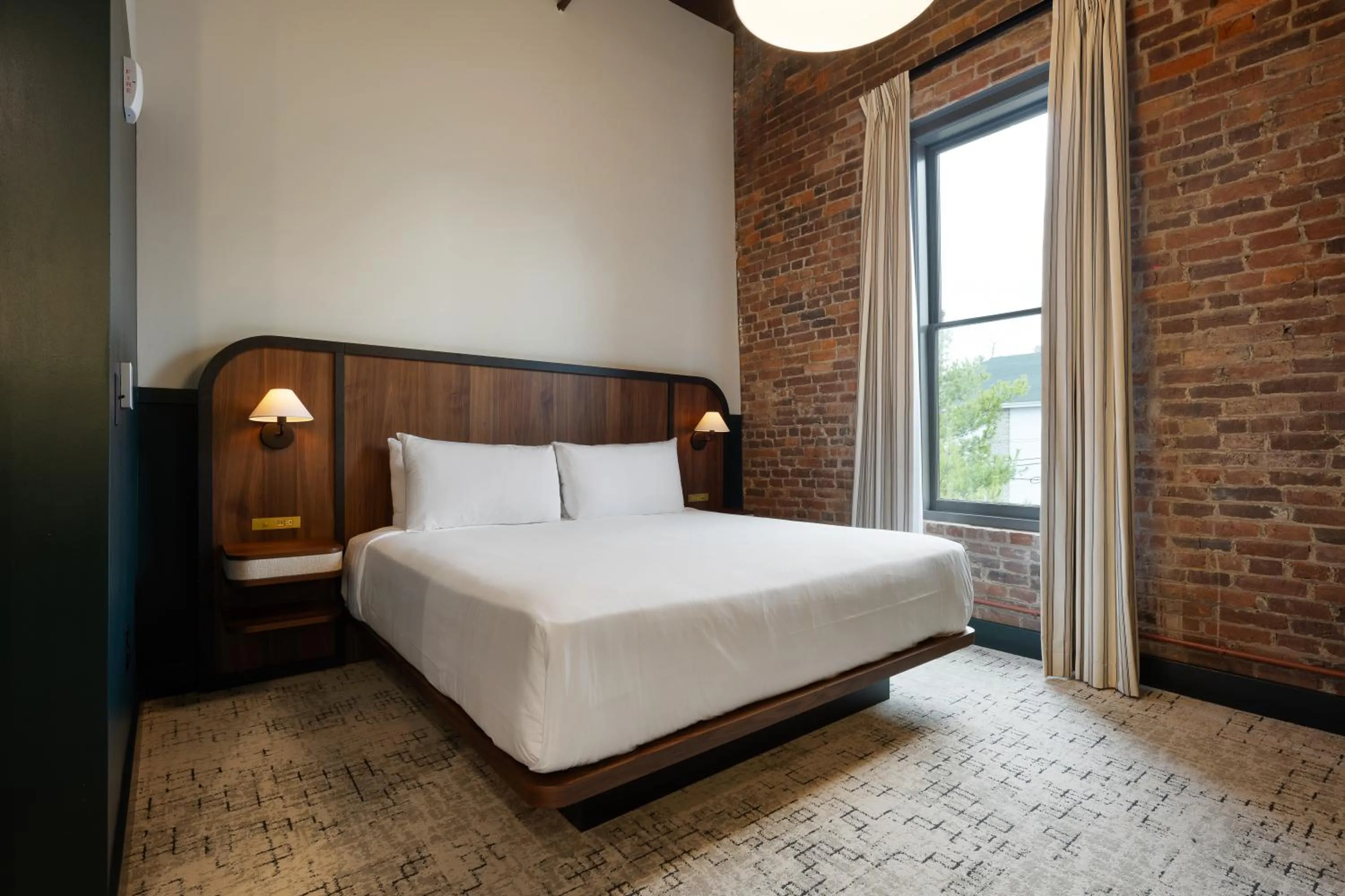 Bed in The Delegate Hotel