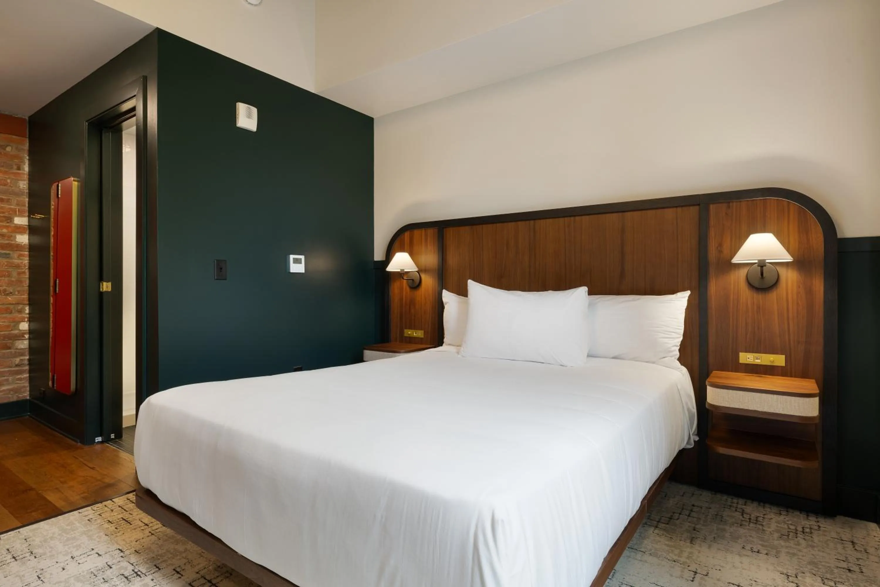 Bed in The Delegate Hotel
