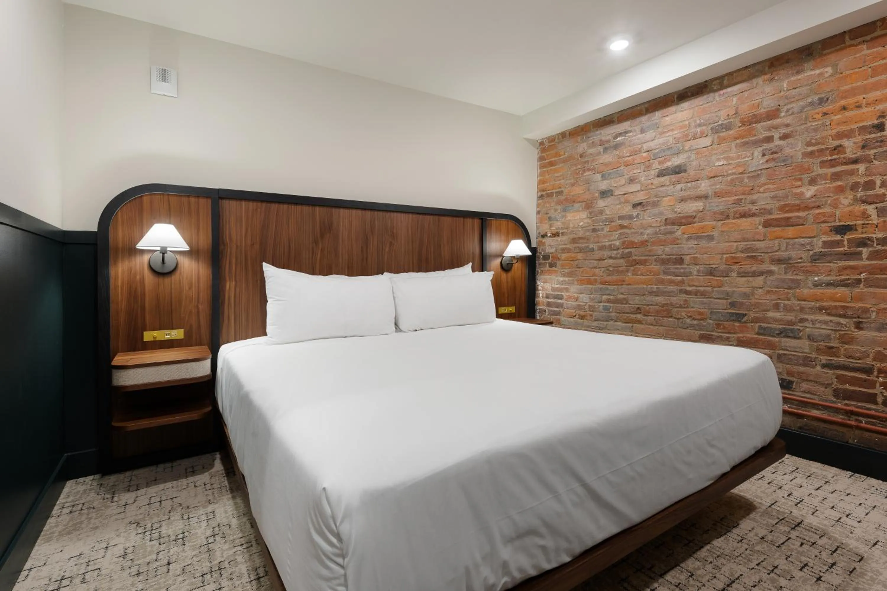 Bed in The Delegate Hotel