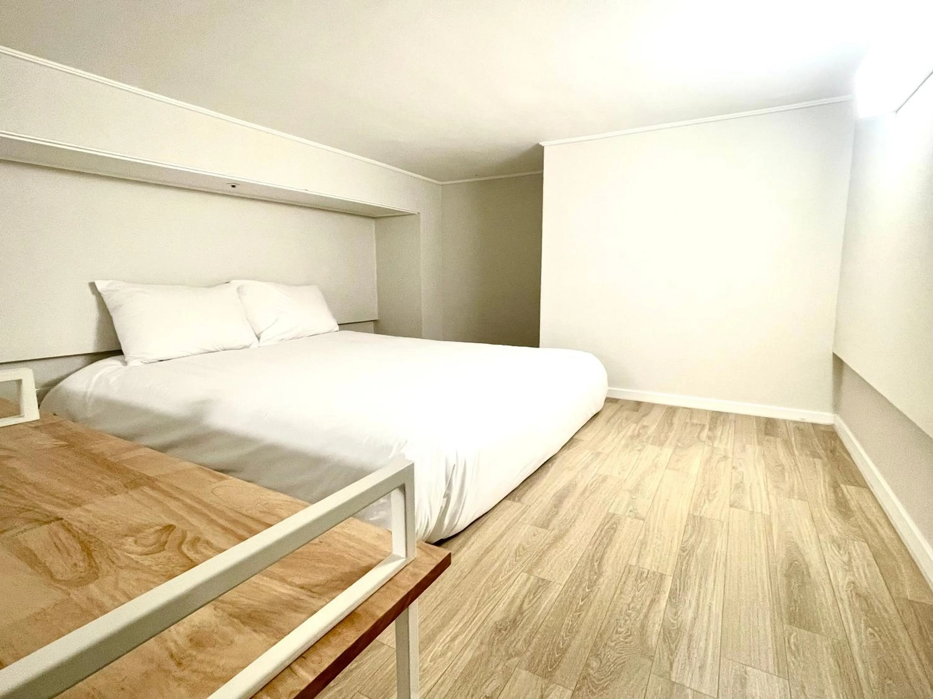 Bed in Blue Ocean Hotel 3