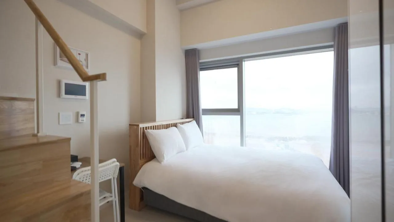 Bed in Blue Ocean Hotel 3