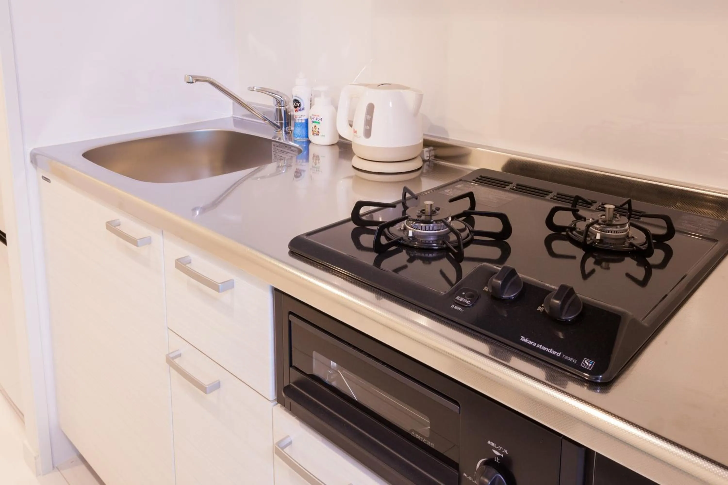 Kitchen or kitchenette in Living Inn Asahibashiekimae Anex