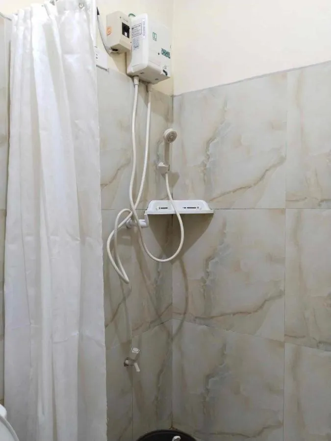 Shower in F and C Guesthouse by Hiverooms