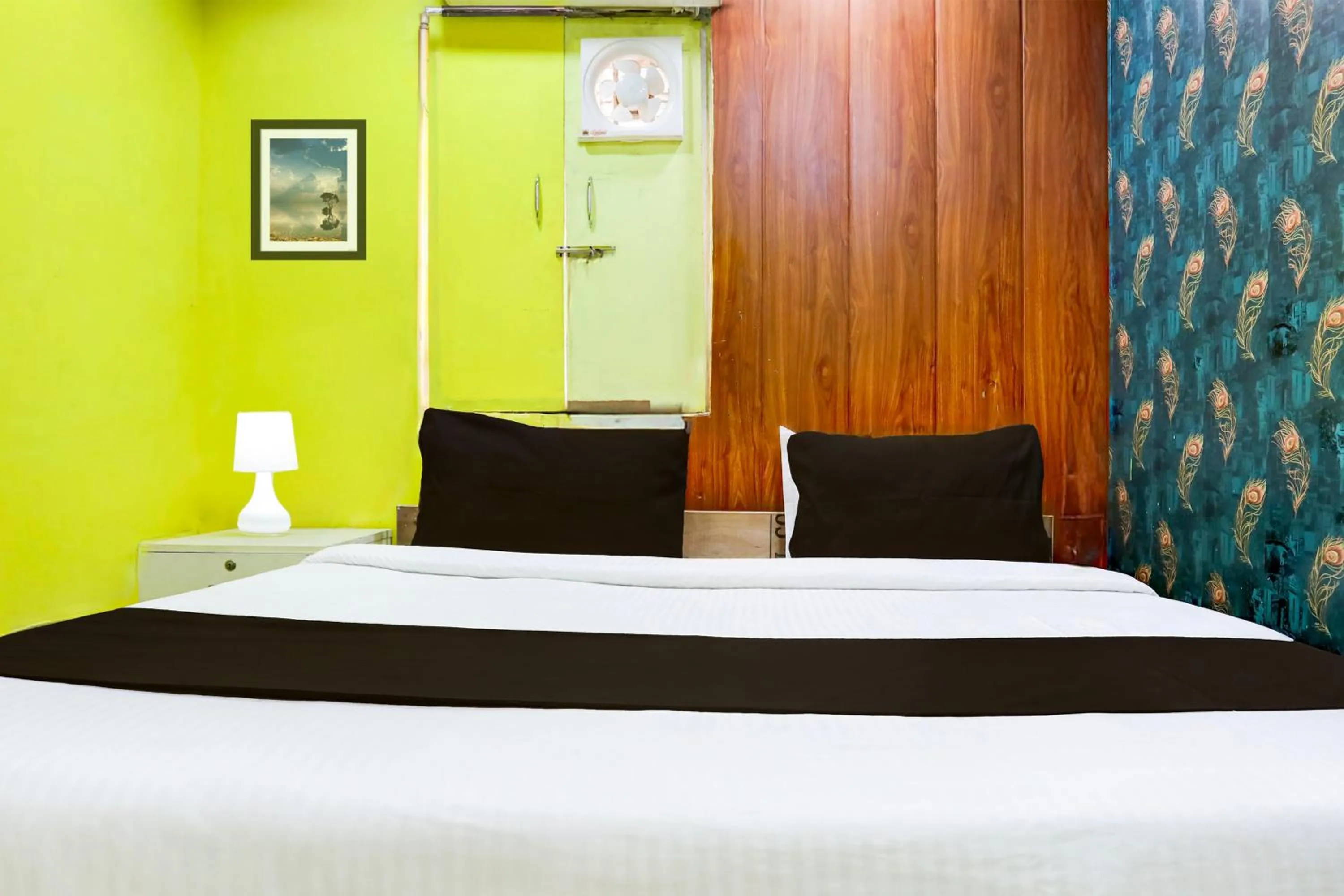 Bedroom in Hotel O A K Residency