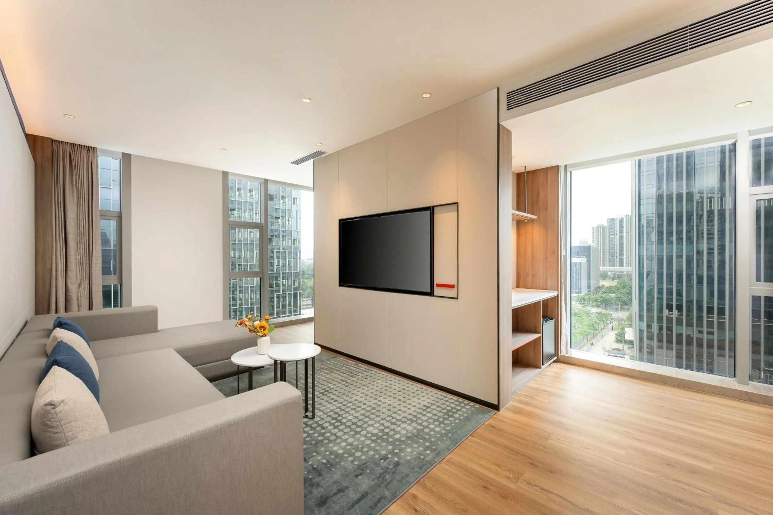 Living room in Holiday Inn Express Shenzhen Guangming by IHG
