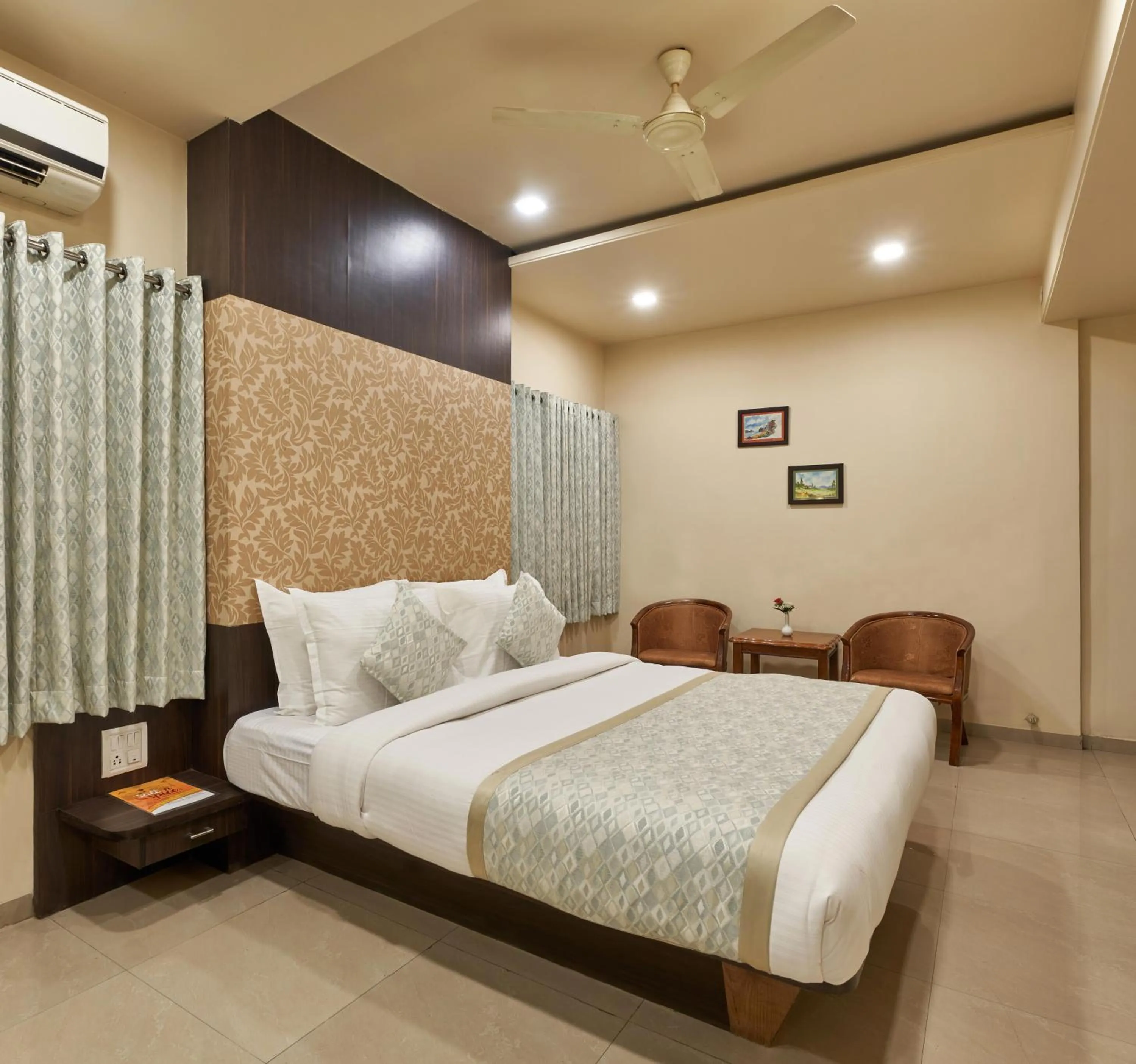 Photo of the whole room, Bed in Hotel Atria, Kolhapur